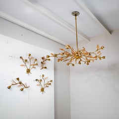 Brass chandelier and 4 wall sconces with glass elements, 1970s