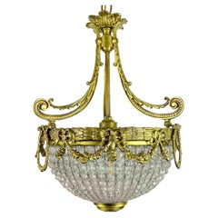 Araña francesa de bronce con copa de cuentas de cristal Principios del siglo XX