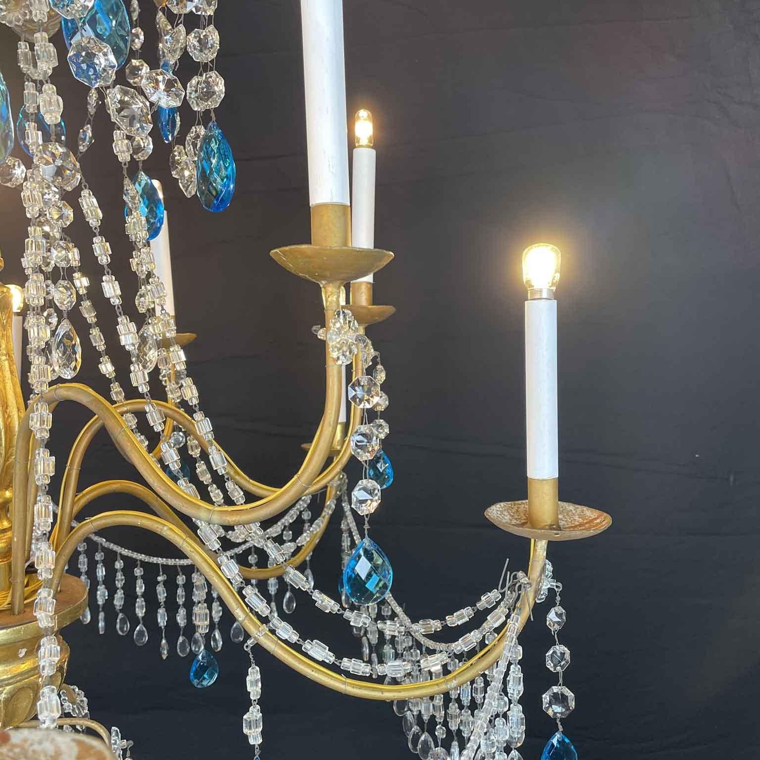 Gold Leaf Italian Genovese Empire Chandelier 1780 in Gilded Wood and Crystal Twelve Lights For Sale