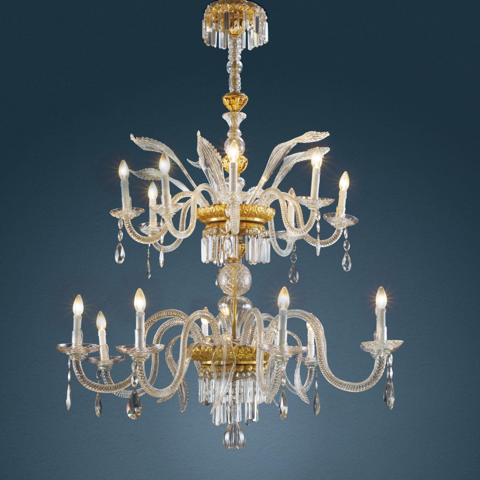 Large Florentine chandelier with 16 lights distributed in double order, dating from the early 19th century. Supported centrally by an iron rod covered with transparent blown glass in different workmanships and interspersed with wooden elements