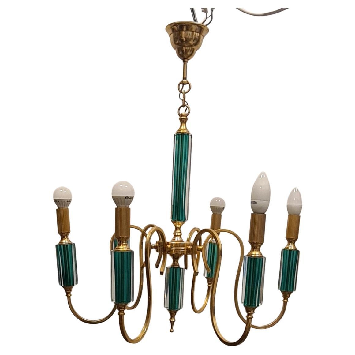 Gilded metal and submerged glass chandelier 1980s' For Sale