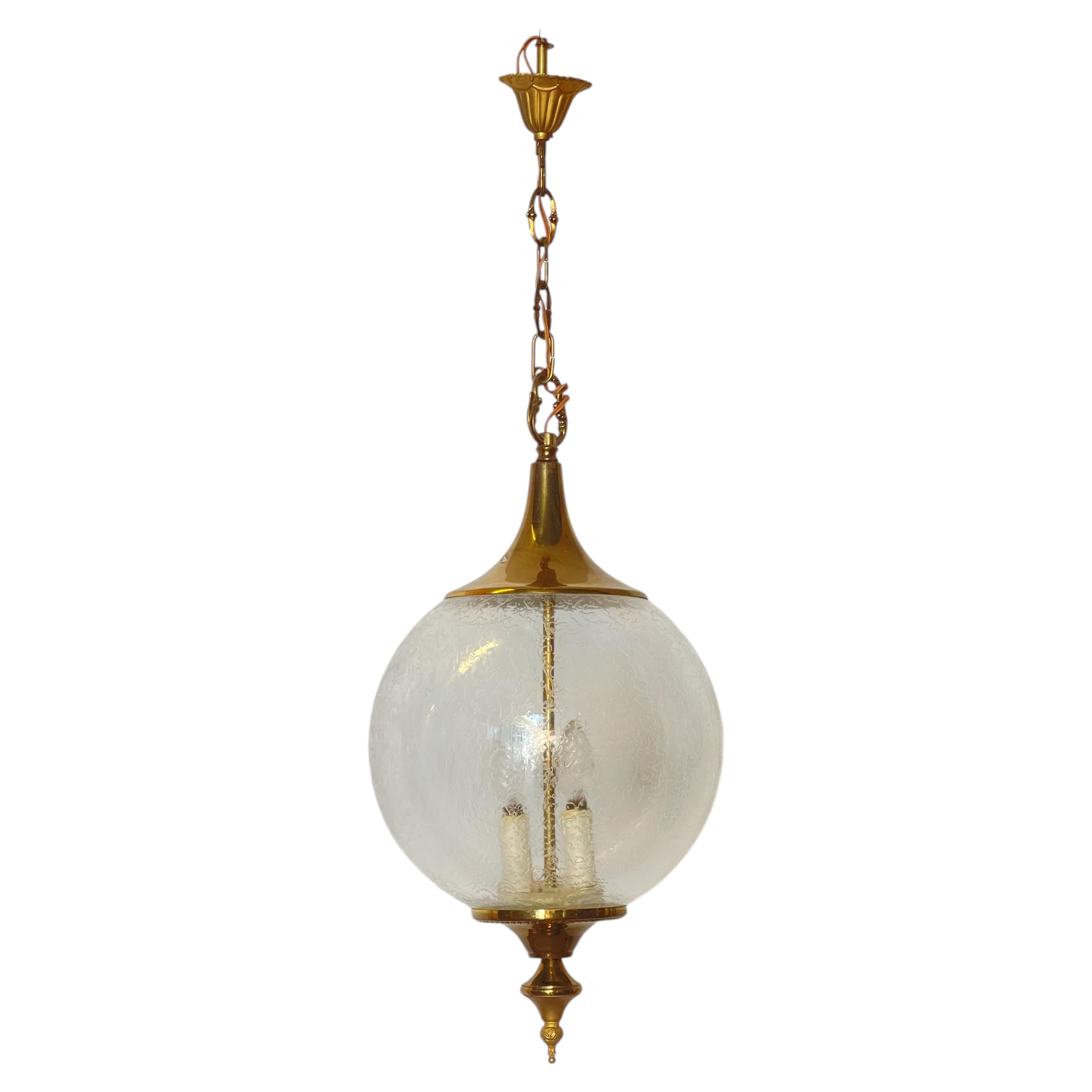 Brass chandelier with worked glass sphere, "Luce Nobile," 1970s