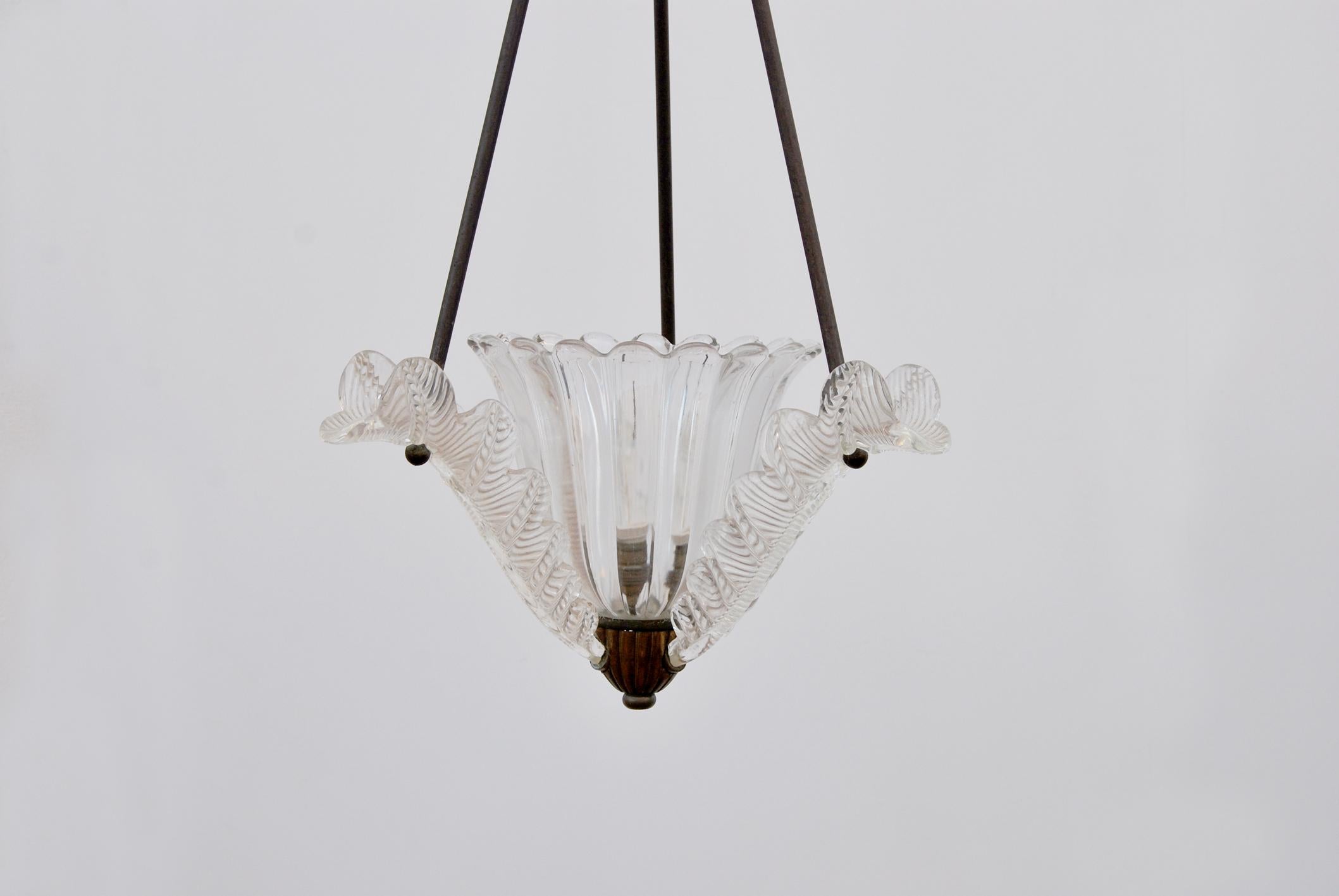 Brass and Murano glass chandelier, 1940s, Made in Italy. 
Murano glass chandelier with brass support rods, preserving the patina of time. 
Product working and in excellent condition. 
The price of shipping is for the Italian territory, for the