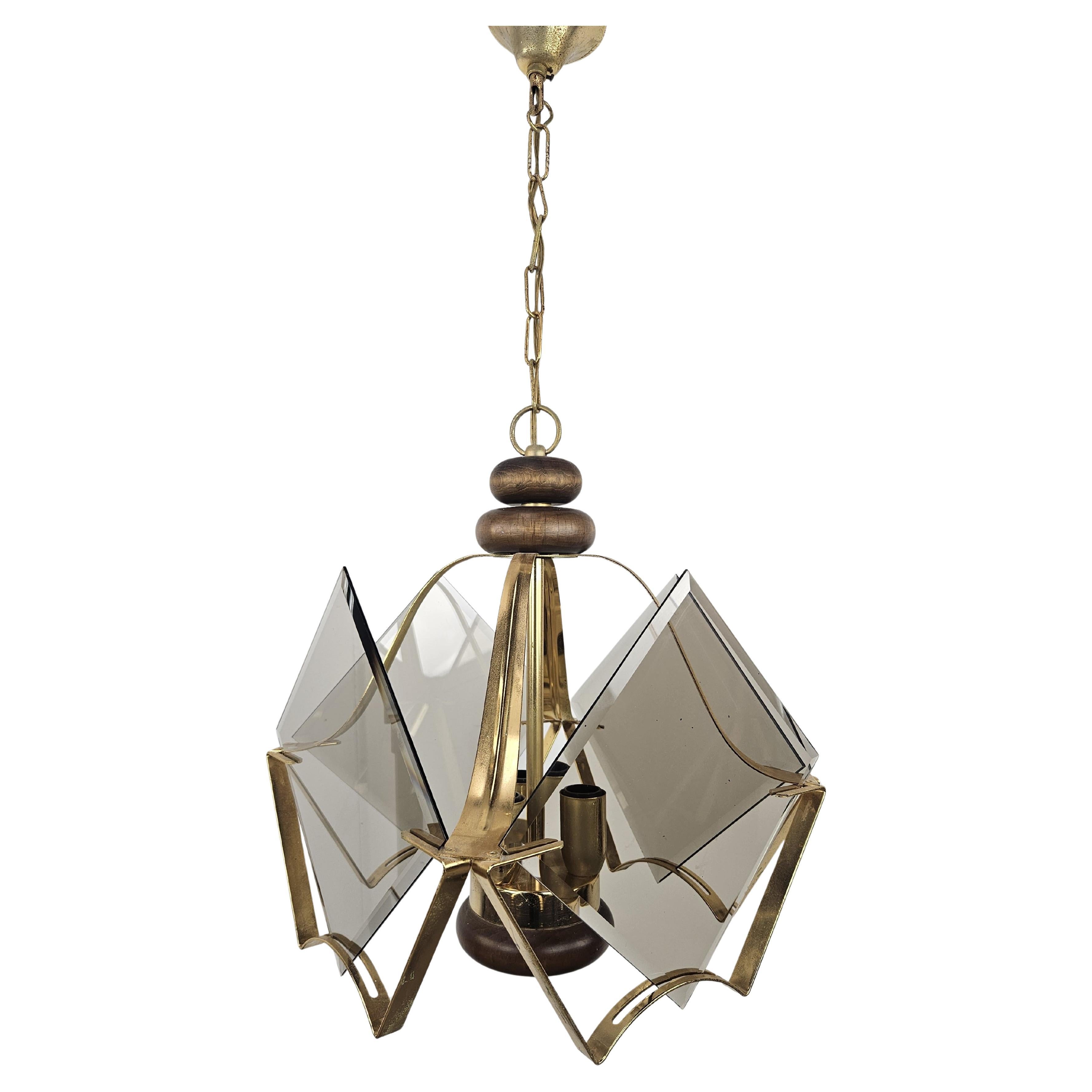 1970s brass and smoked glass chandelier with three light points
