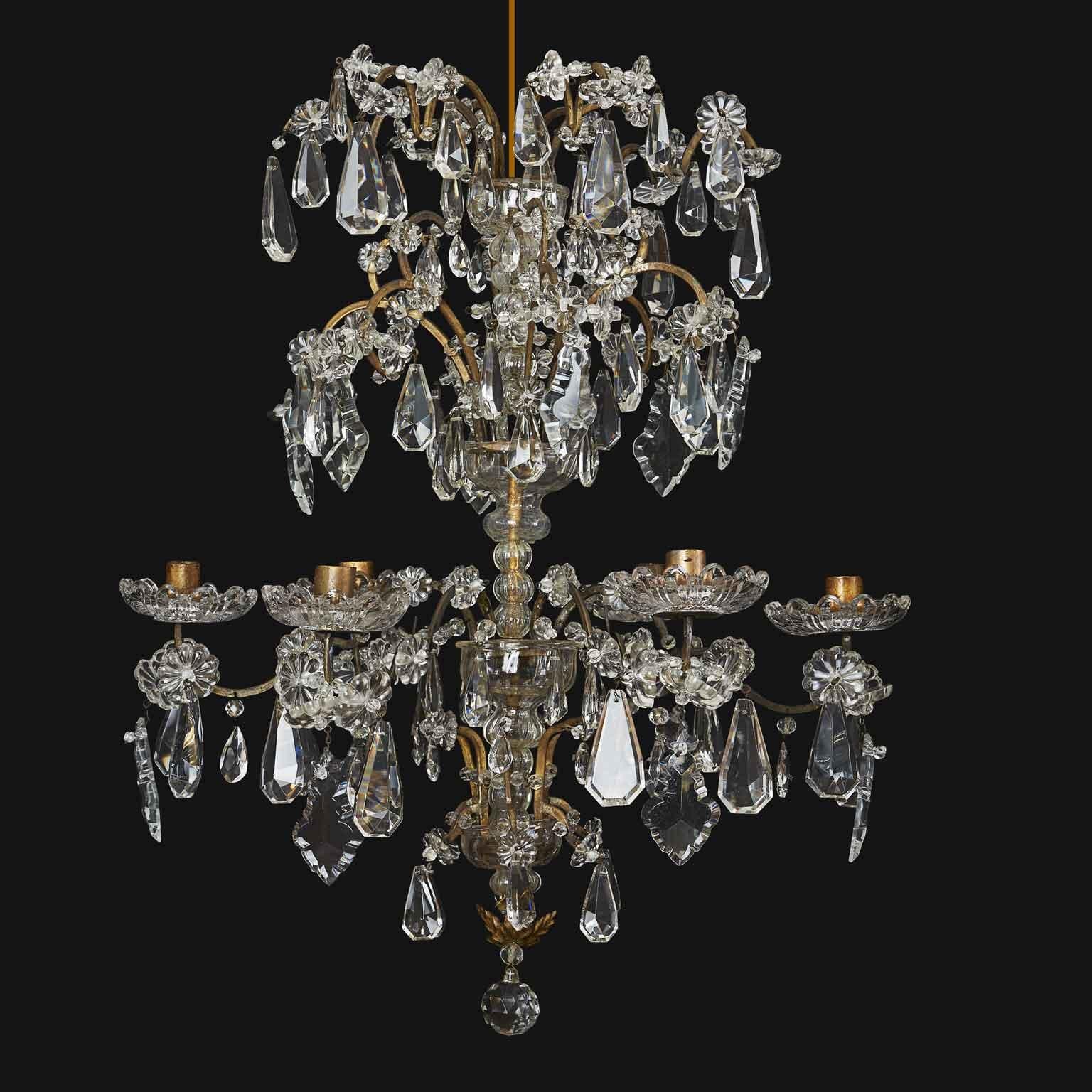 Delightful mid-1800s Italian gold-plated brass and crystal six-light chandelier made entirely by hand and  born for candle lighting; the structure has a central stem lined with crystal vases, from the lower part of which depart six curved arms