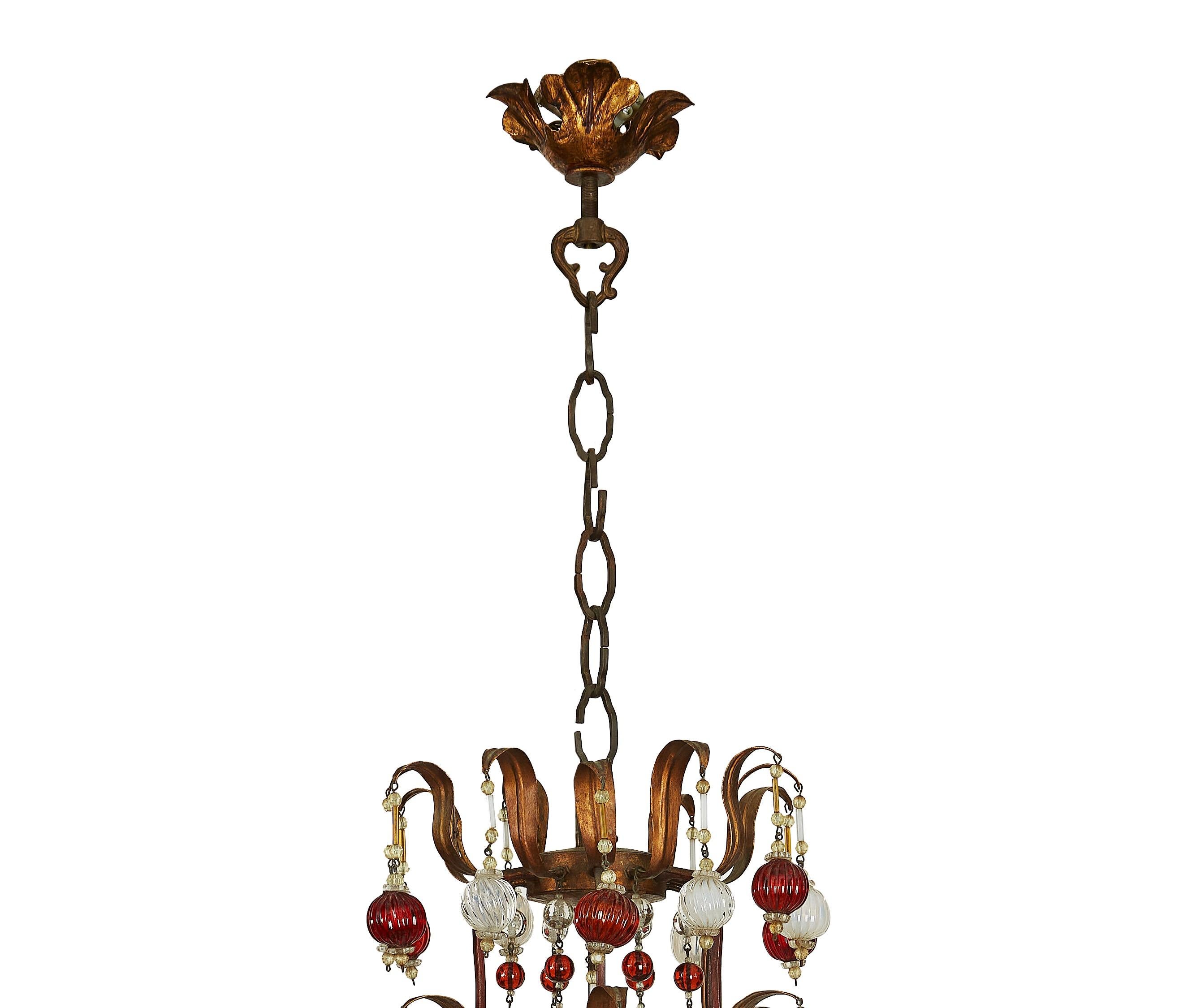 20th Century Italian Gilded Iron and Red and White Glass Chandelier circa 1960, Twelve Lights For Sale