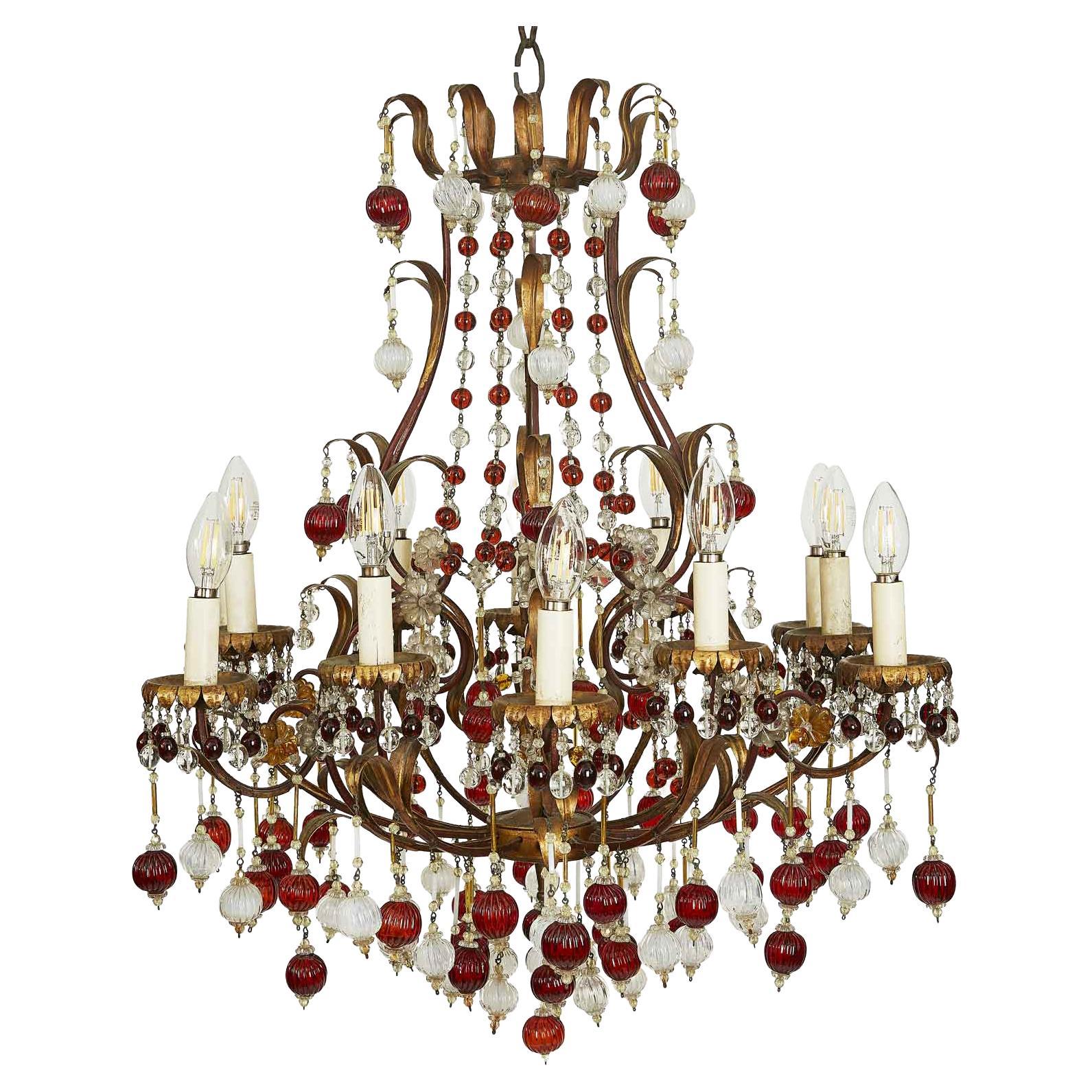 Italian Gilded Iron and Red and White Glass Chandelier circa 1960, Twelve Lights