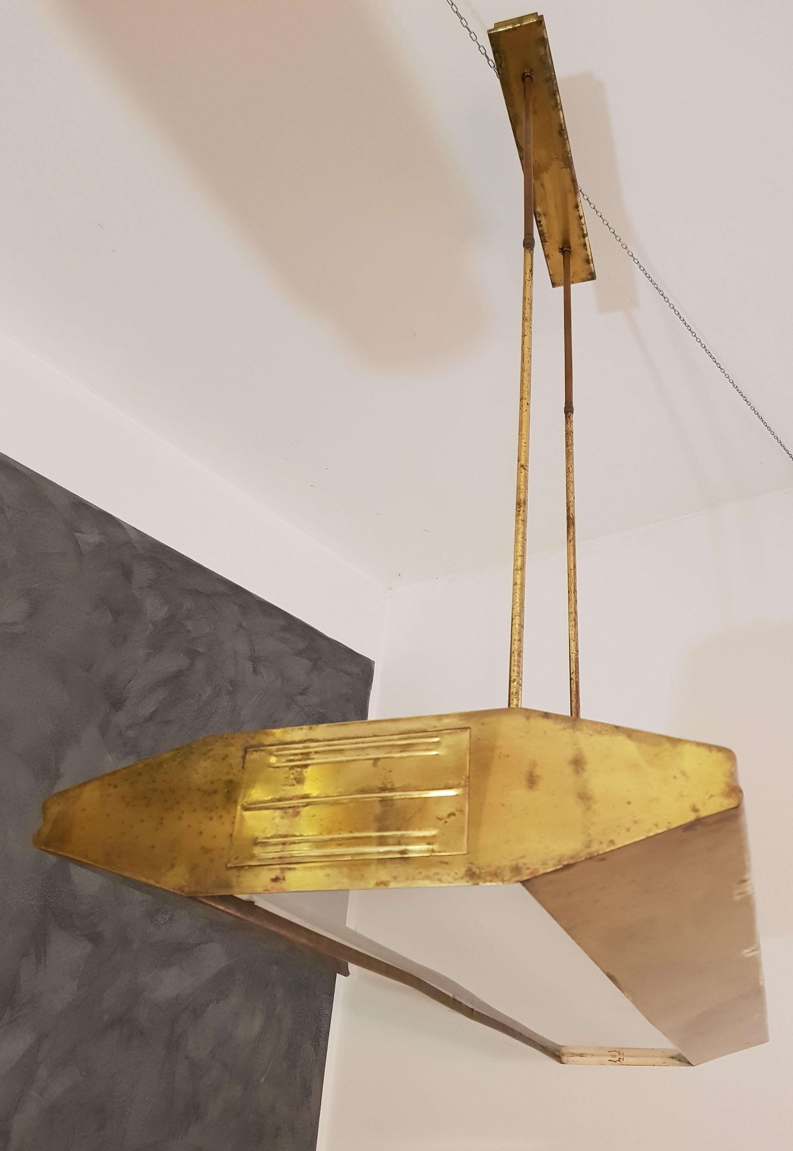 Large and rare monumental chandelier in Carlo Mollino style with fluorescent light with plexiglass diffuser and brass structure, Italy, 1950.