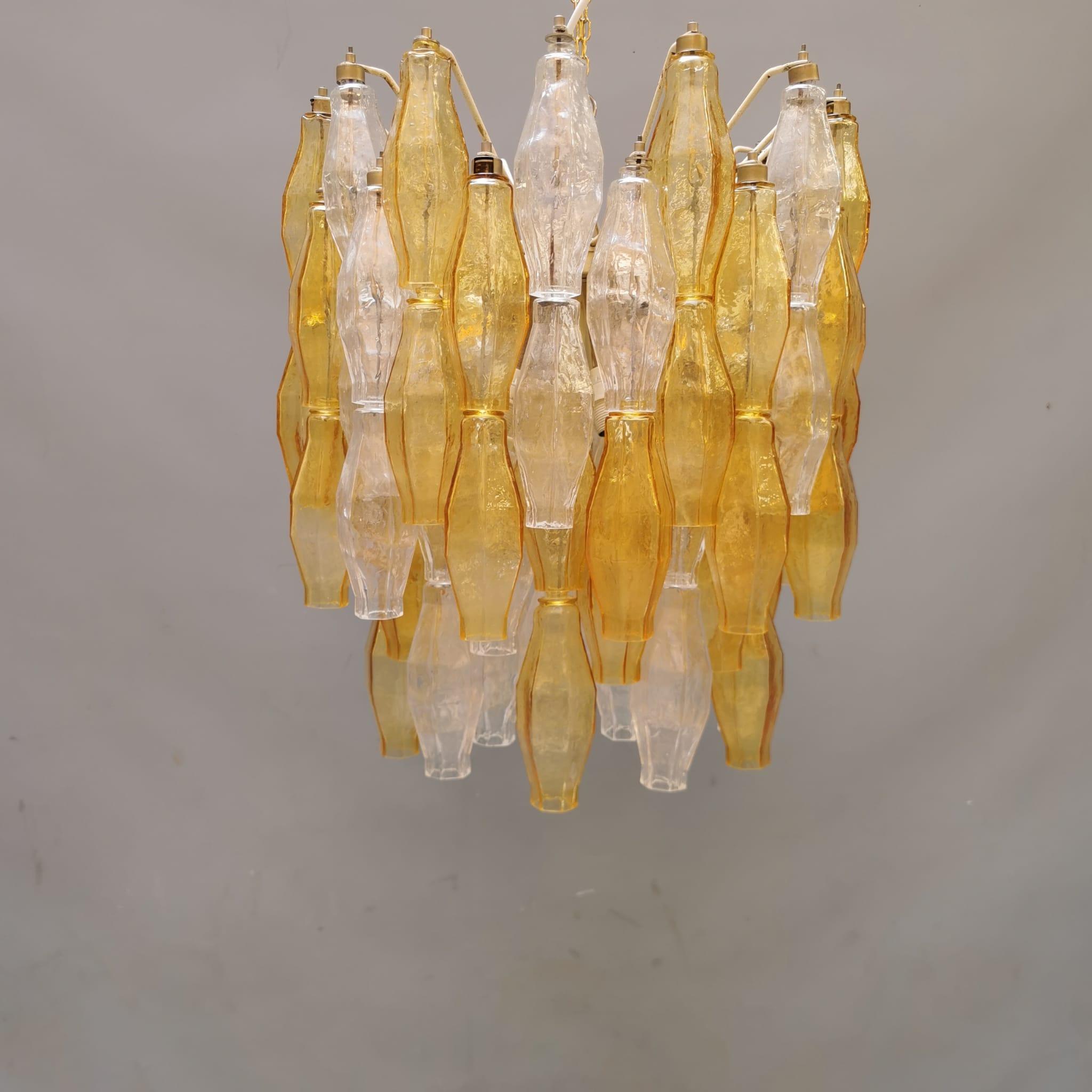 Poliedri is a modular glass chandelier designed by Carlo Scarpa for Venini. In 1958 the chandelier triumphed at the Expo in Brussels, at the centre of the Italian pavilion. Since then its infinitely glittering appearance of polyhedrons has continued