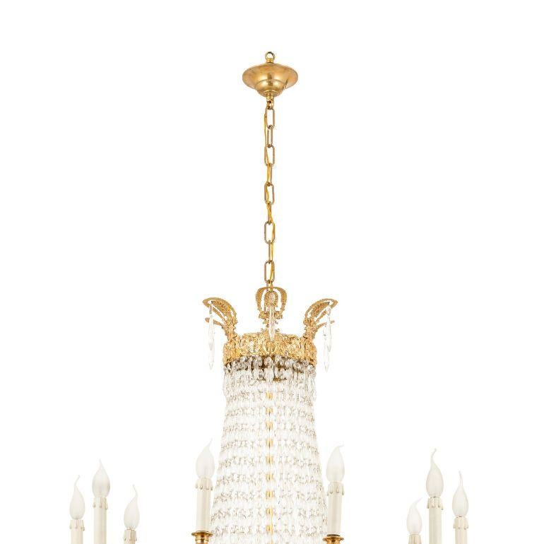 Elevate your space with our exquisite 10-light chandelier, featuring a timeless bronze frame adorned with beautiful crystal drops. This chandelier perfectly blends classic design with meticulous craftsmanship, casting a hypnotic and opulent glow