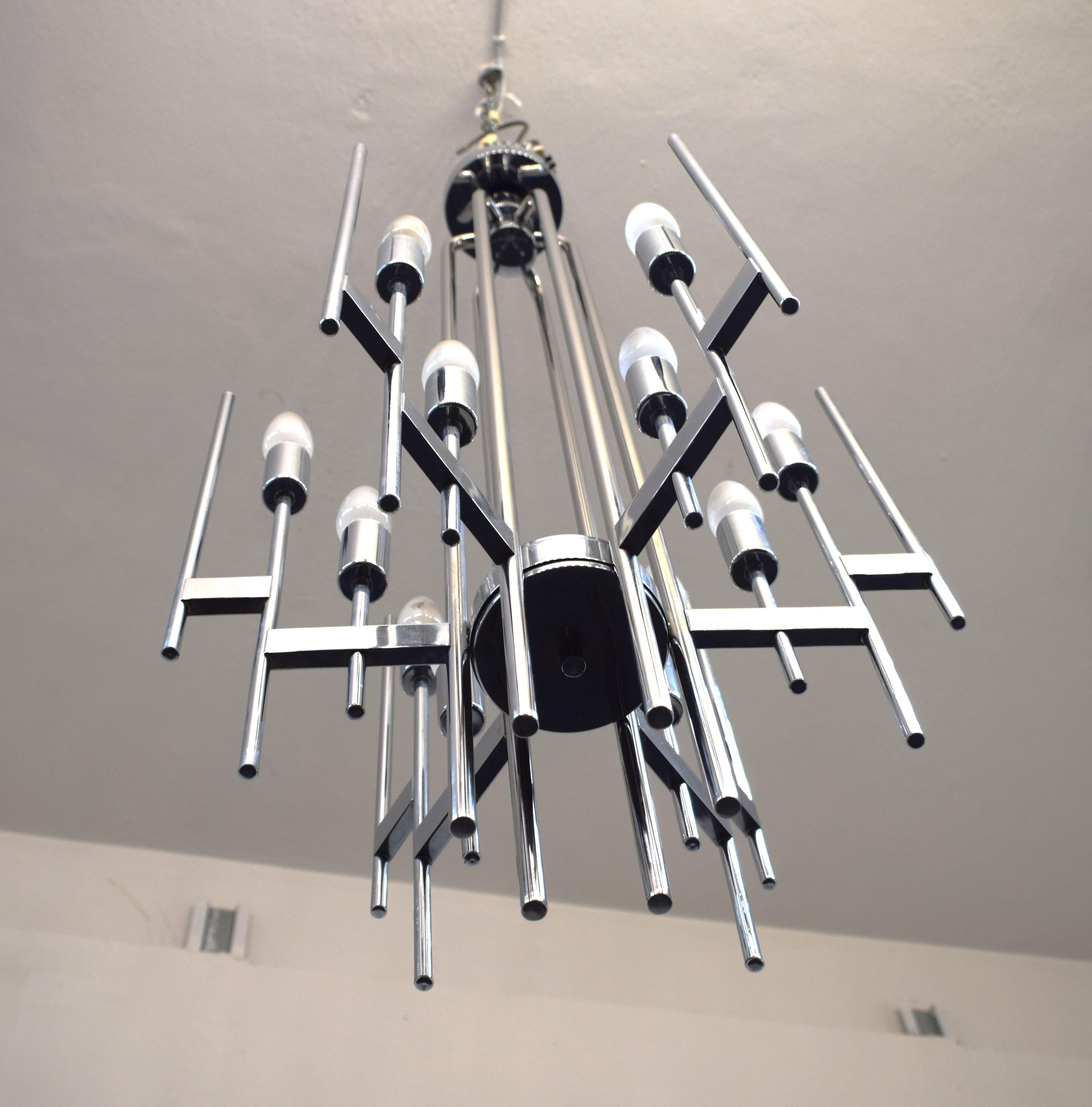 Beautiful chrome-plated steel chandelier made by Sciolari, Italy, circa 1970s.
Excellent condition, no defects or missing, normal signs of time.
Dimensions: H= 104 cm; D= 45 cm.
Professional packaging and safe worldwide shipping is guaranteed.