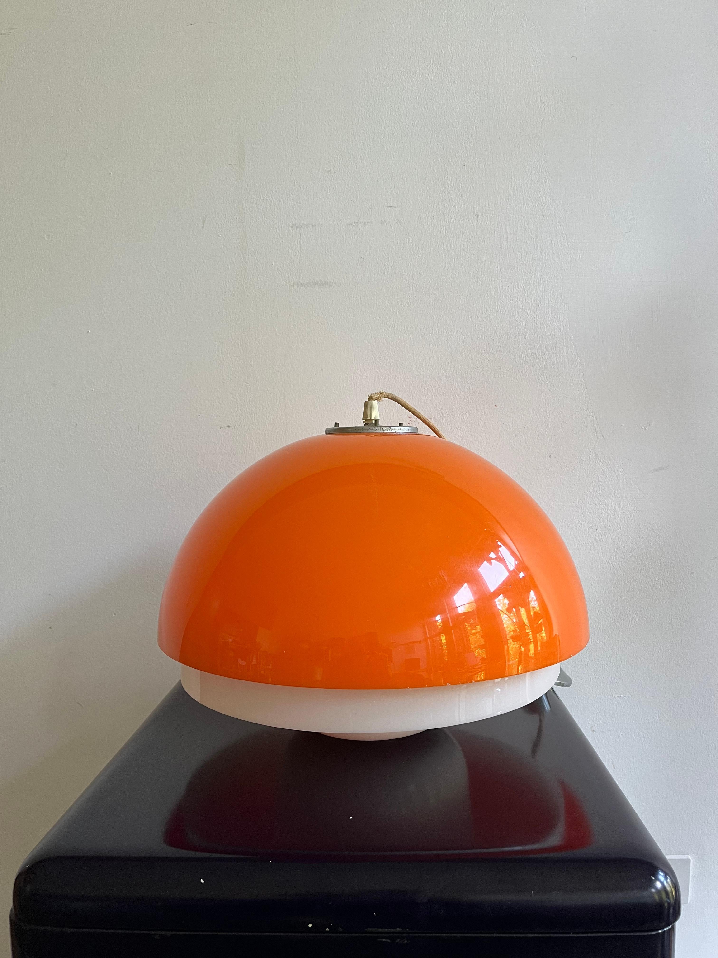 Plastic chandelier with orange and white double canopy. 

Overall good condition with minor signs of time.


