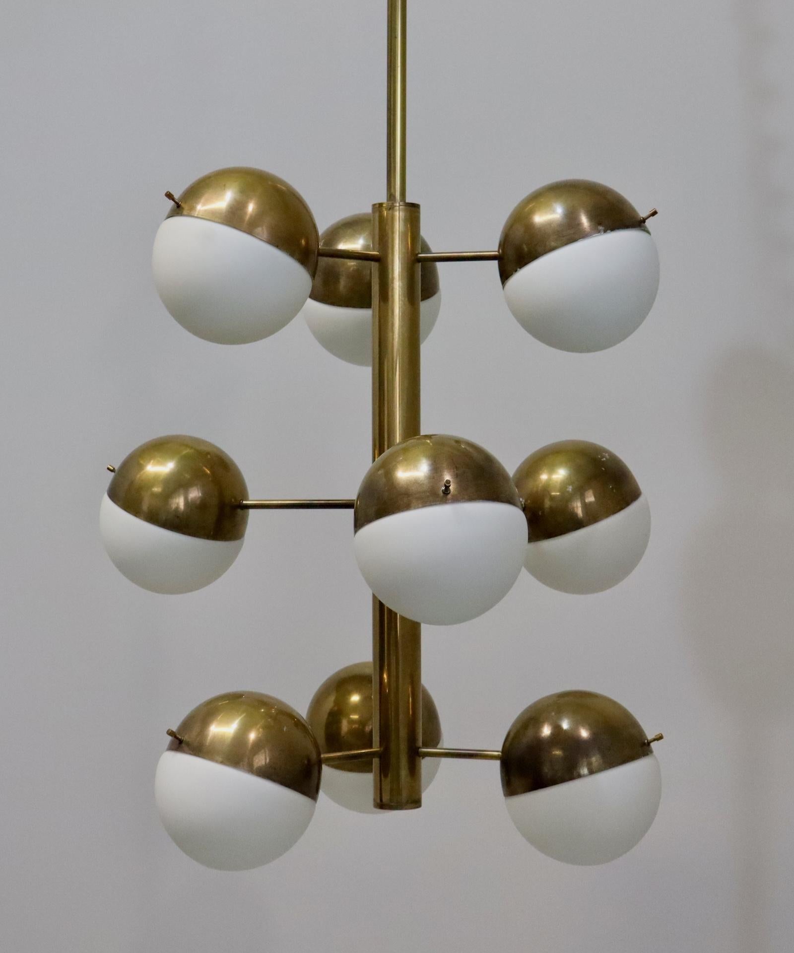 Stilnovo large brass and opal glass pendant chandelier, model 1129, Italy 
It is a chandelier that can surprise with its originality and refinement, produced in few examples and hard to find, it will give elegance and grit to your home environment