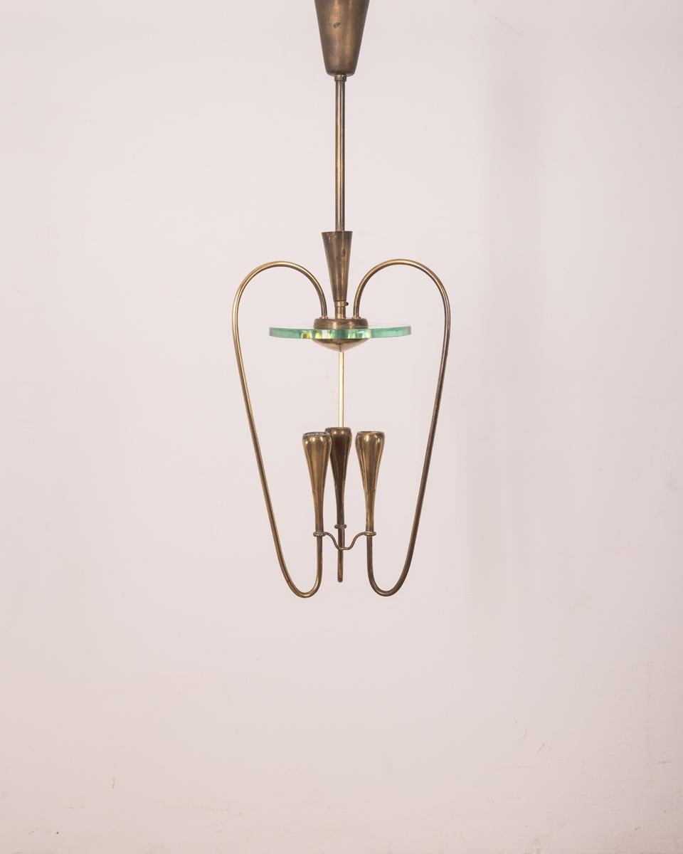 Chandelier with gilt brass frame, three lights with clear crystal. Design Pietro Chiesa for Fontana Arte, 1940s.

CONDITION: In good condition, working, shows signs of wear given by time.

DIMENSIONS: Height 80 cm; Diameter 26 cm

MATERIAL: Brass