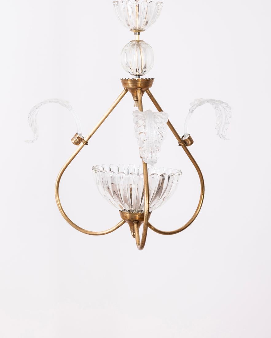 Chandelier with gilt brass frame and Murano glass, Italian design, 1950s.

CONDITION: In good condition, working, shows signs of wear given by time.

DIMENSIONS: Height 55 cm; Diameter 48 cm

MATERIAL: Brass and Glass

YEAR OF PRODUCTION: Anni 50
