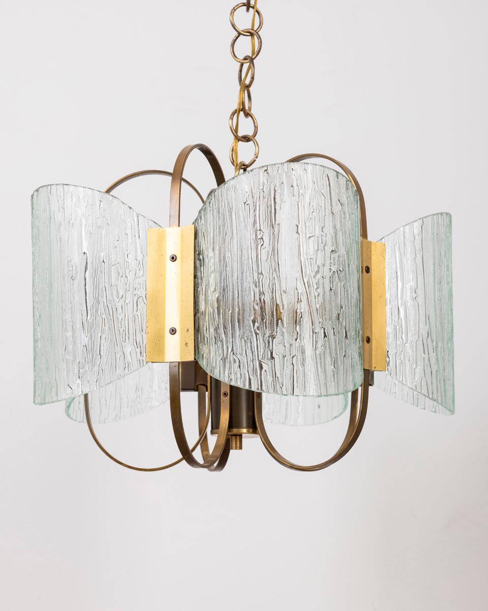 Chandelier with gilt brass frame and worked glass shades, five lights, Italian design, 1960s.

CONDITION: In good, working condition, may show signs of wear given by time.

DIMENSIONS: Height 105 cm; Diameter 44 cm

MATERIAL: Brass and Glass

YEAR