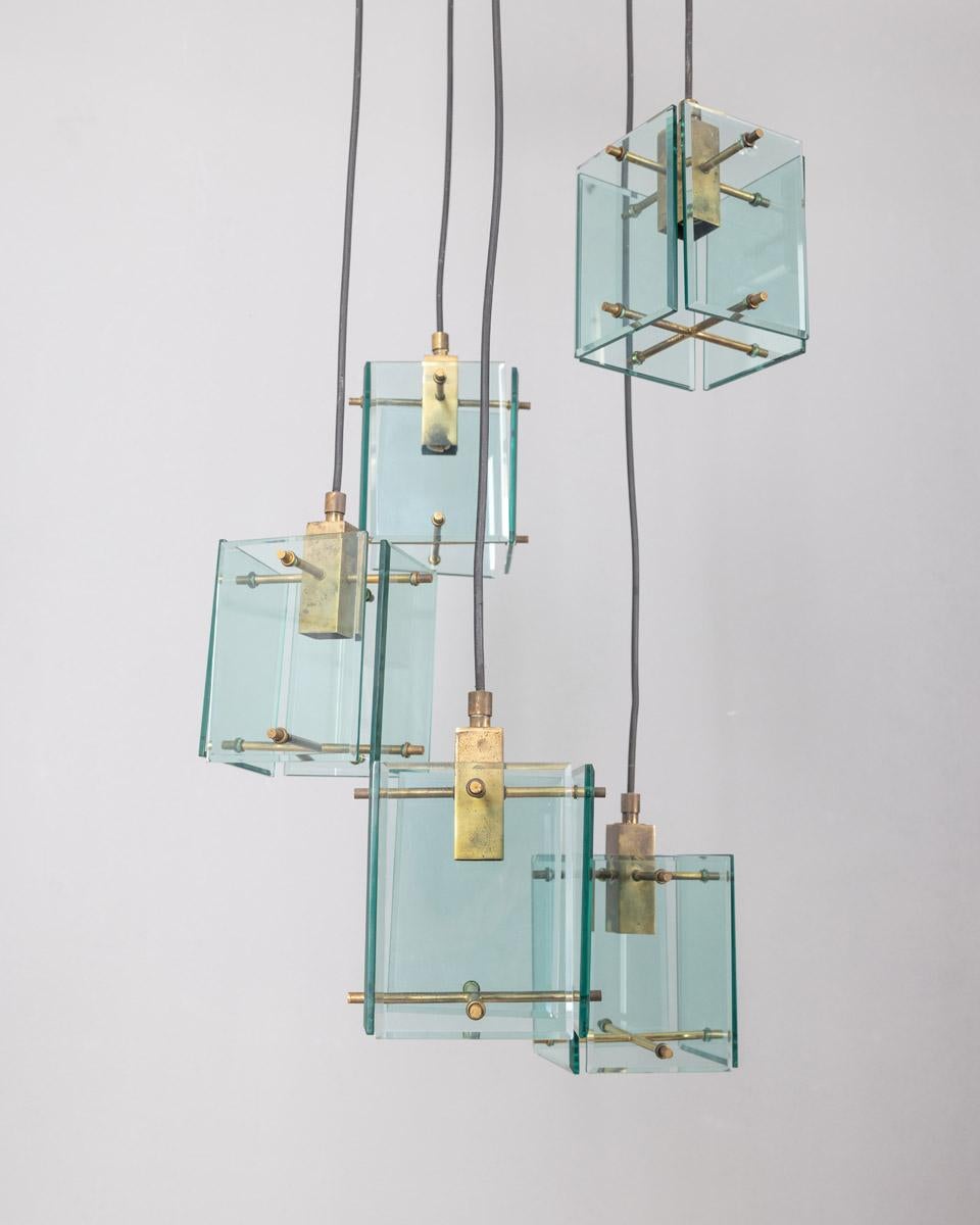 Chandelier with chrome-plated metal base with five turquoise murano glass pendants and gold-plated brass inserts, design Studio Zeroquattro Milan, 1960s.

CONDITION:
In good, working condition, may show signs of wear given by time.

SIZING: 
Height