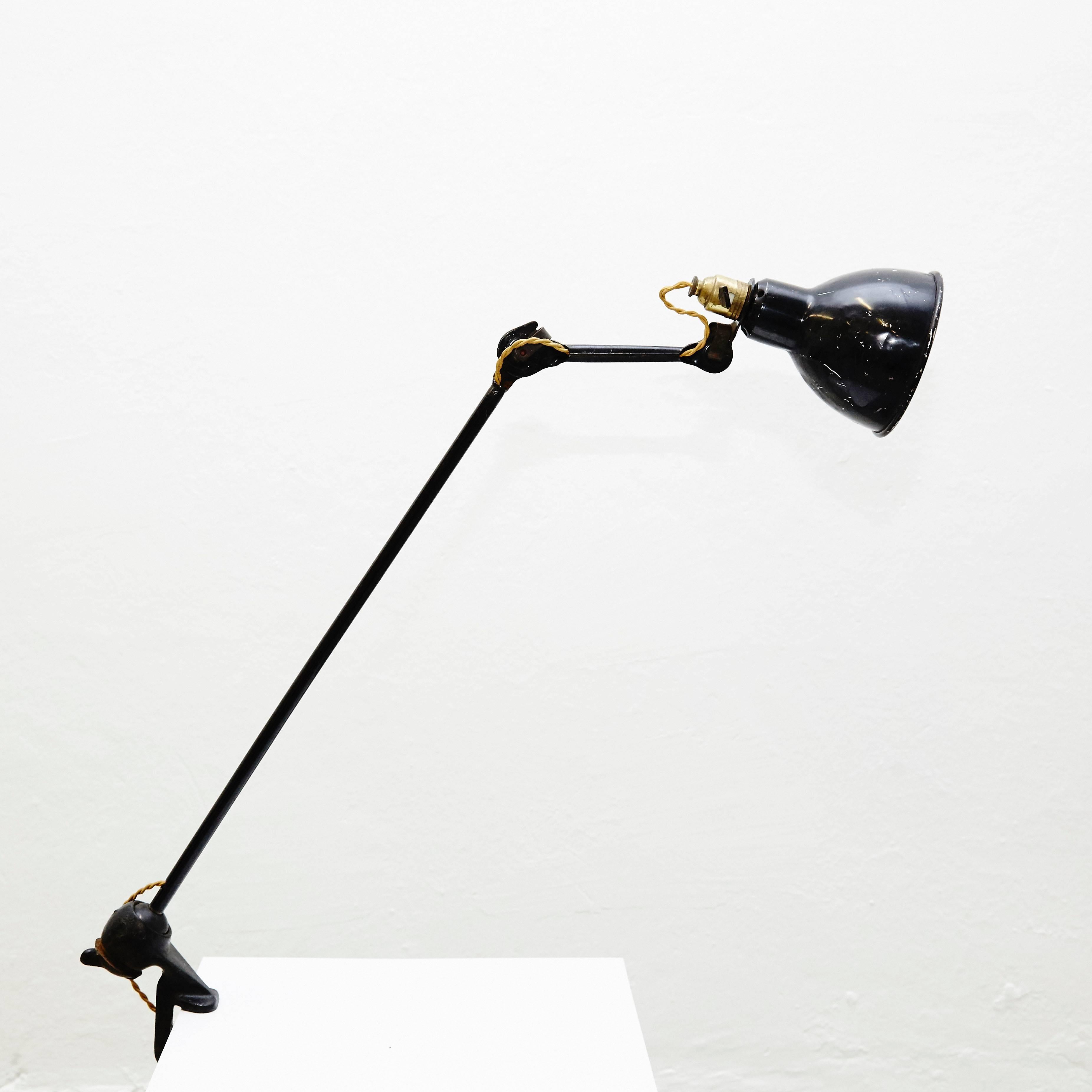 Table lamp designed by Bernard-Albin Gras.
Manuactured by Gras (France), circa 1930.
Aluminium and steel.

In good original condition, with minor wear consistent with age and use, preserving a beautiful patina.

In 1922 Bernard-Albin Gras