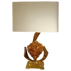 Lamp decorated with a golden rock crystal geode.