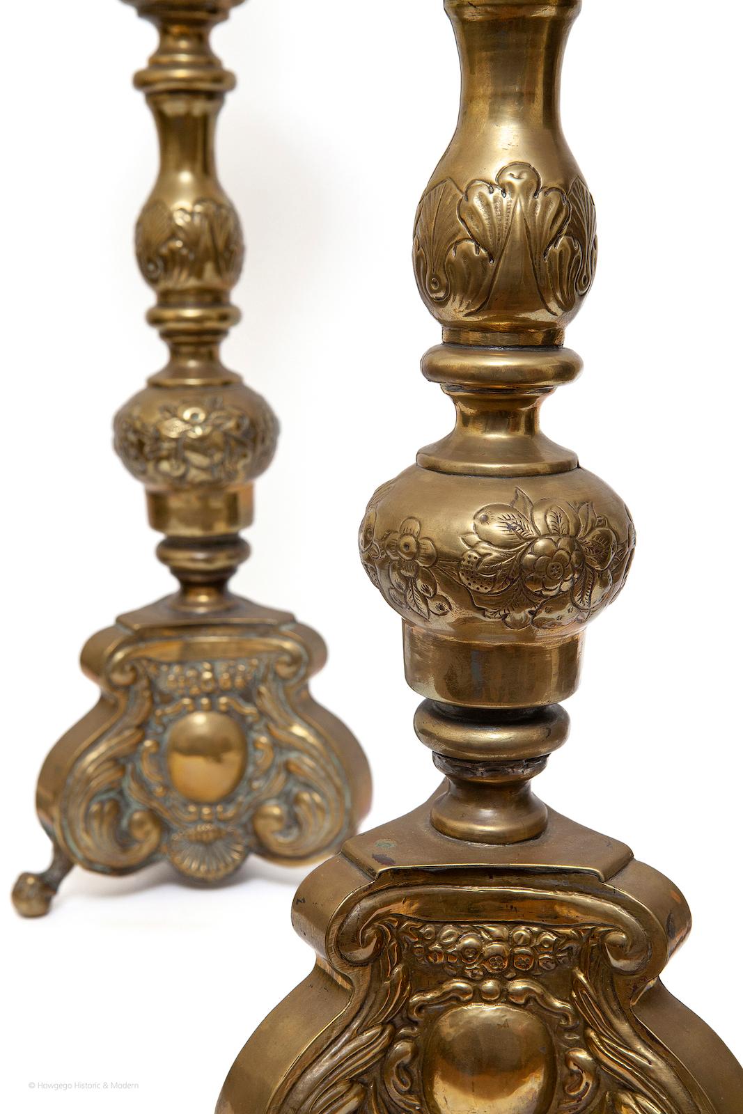 A Pair of 19th century, antiquarian, baroque-revival, brass, repousse, pricket candlesticks upcycled into a pair of table lamps, 27“ high

Finely chased with characteristic Baroque ornamentation
Unusual to find a pair of period candlesticks of