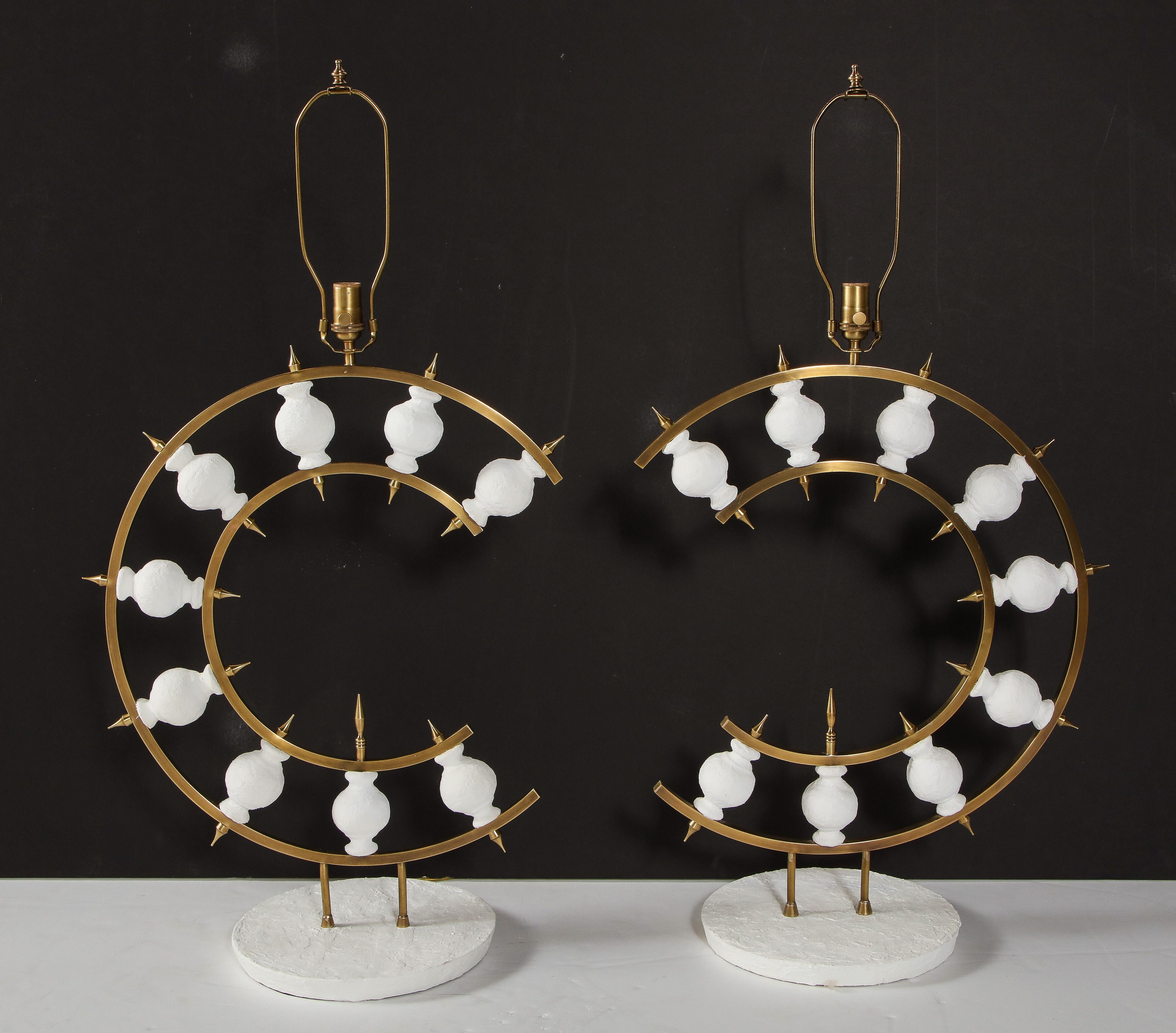 Decorative pair of plaster lamps designed by a local New York artist. The lamps are a combination of brass and white plaster. We have them in stock.