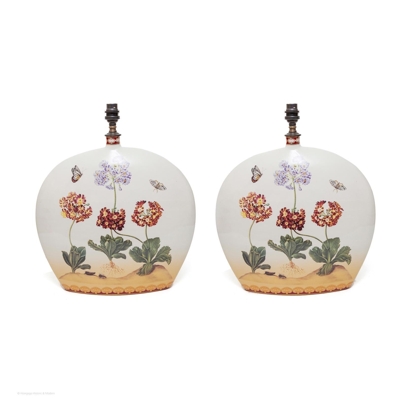 An unusual pair of narrow 3”, naturalistic, bottle shaped lamps with flowers and butterflies on both sides, 17” high
Pretty and unusual in form and depth, injecting the natural world into the interior
These lamps have a naturalistic aesthetic, the