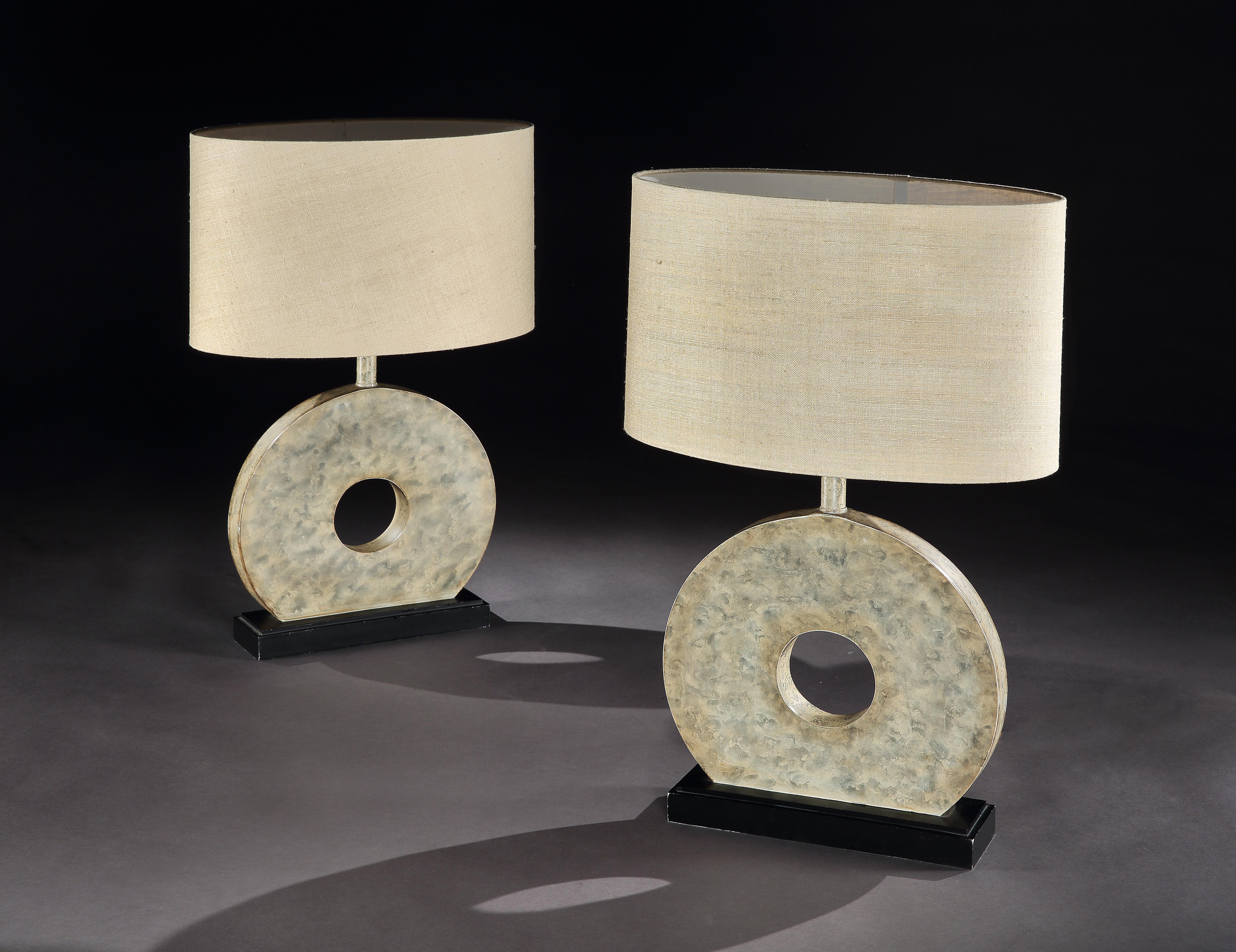 Rare, pair of Mid-Century Modern, marbled, circle, table lamps with custom made, linen shades, 41cm, 16” high
Striking and unusual, injecting Classic design, balance and softness into the interior

- The circle with a central point or hole is an