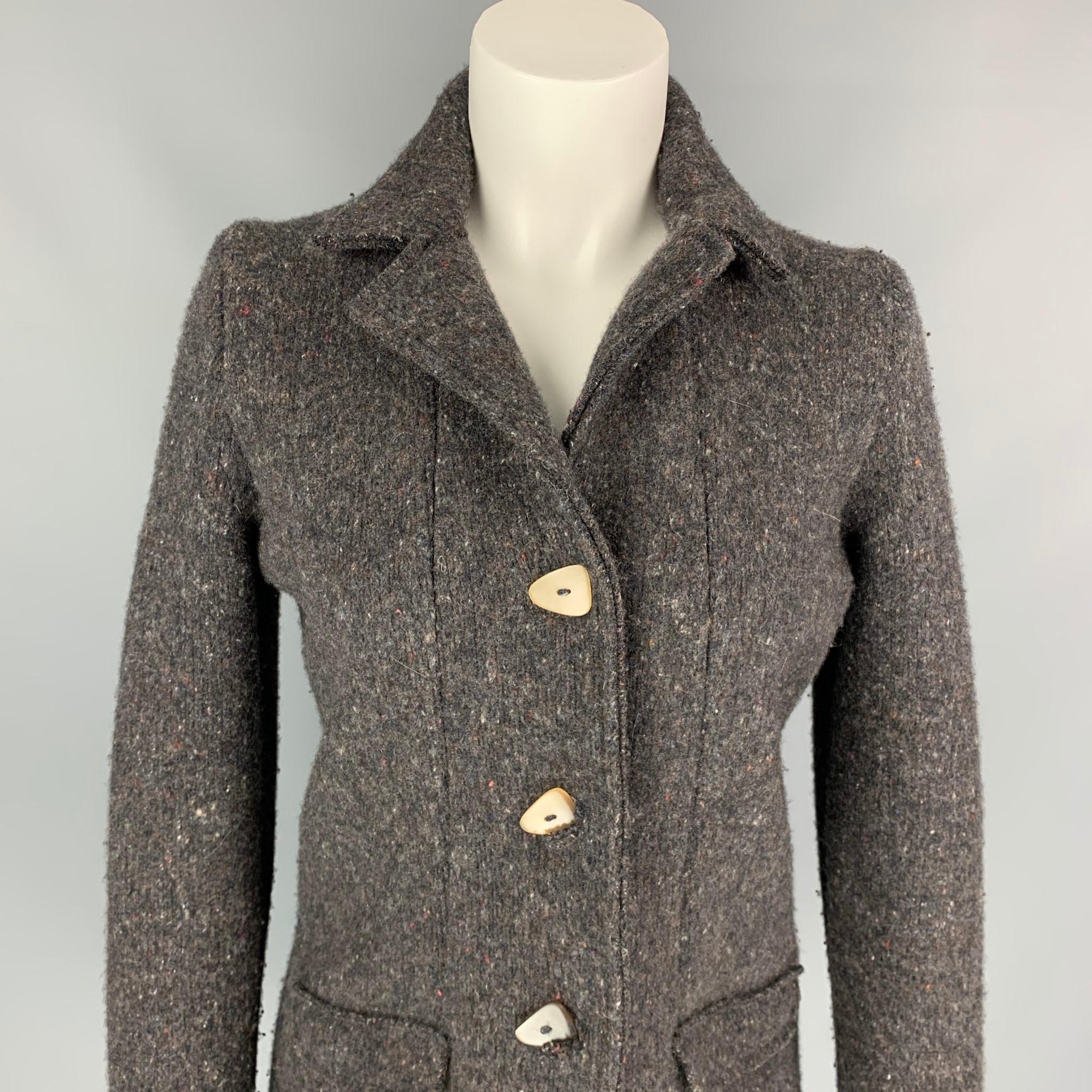 LANA BILZERIAN coat comes in a brown heather wool / cashmere featuring a spread collar, flap pockets, and a three button closure. Made in Italy. 

Very Good Pre-Owned Condition.
Marked: M

Measurements:

Shoulder: 15 in.
Bust: 38 in.
Sleeve: 27