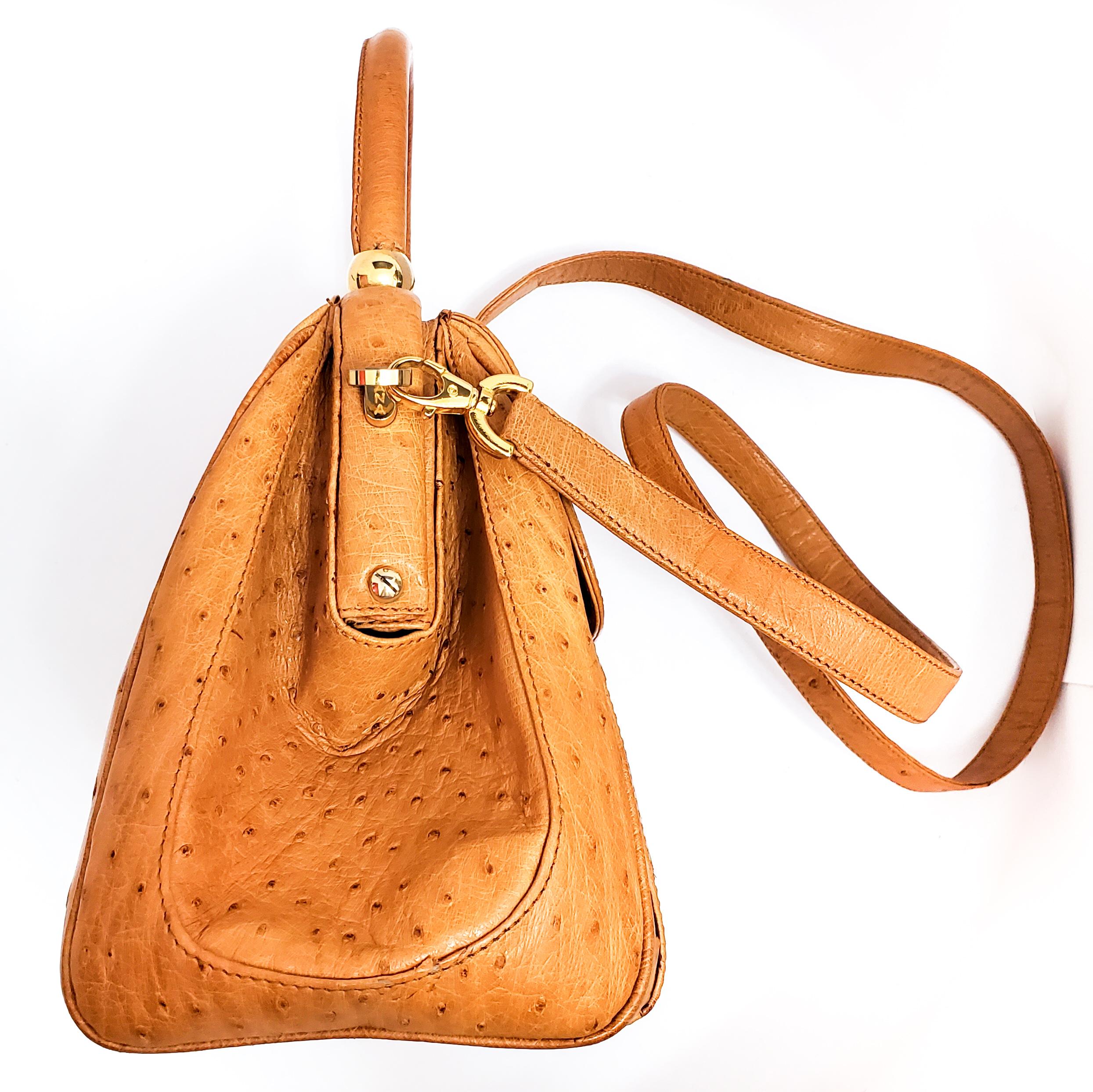 Lana Marks is known world wide for stunning beautifully crafted handbags.  This honey ostrich convertible bag is highly collectable and sought after.  Top handle is permanent with a drop of 4 1/2