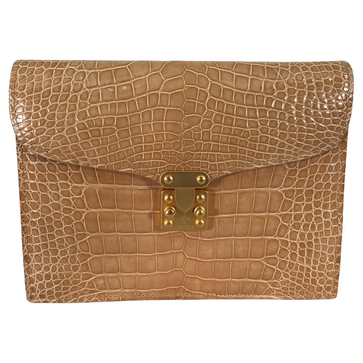 Lana of London blond alligator clutch or shoulder bag with a detachable gold box chain. Beautiful light golden blond bag has a flap front with matte gold tab & button closure. The bag is perfect for afternoon & evening. Lana of London was a