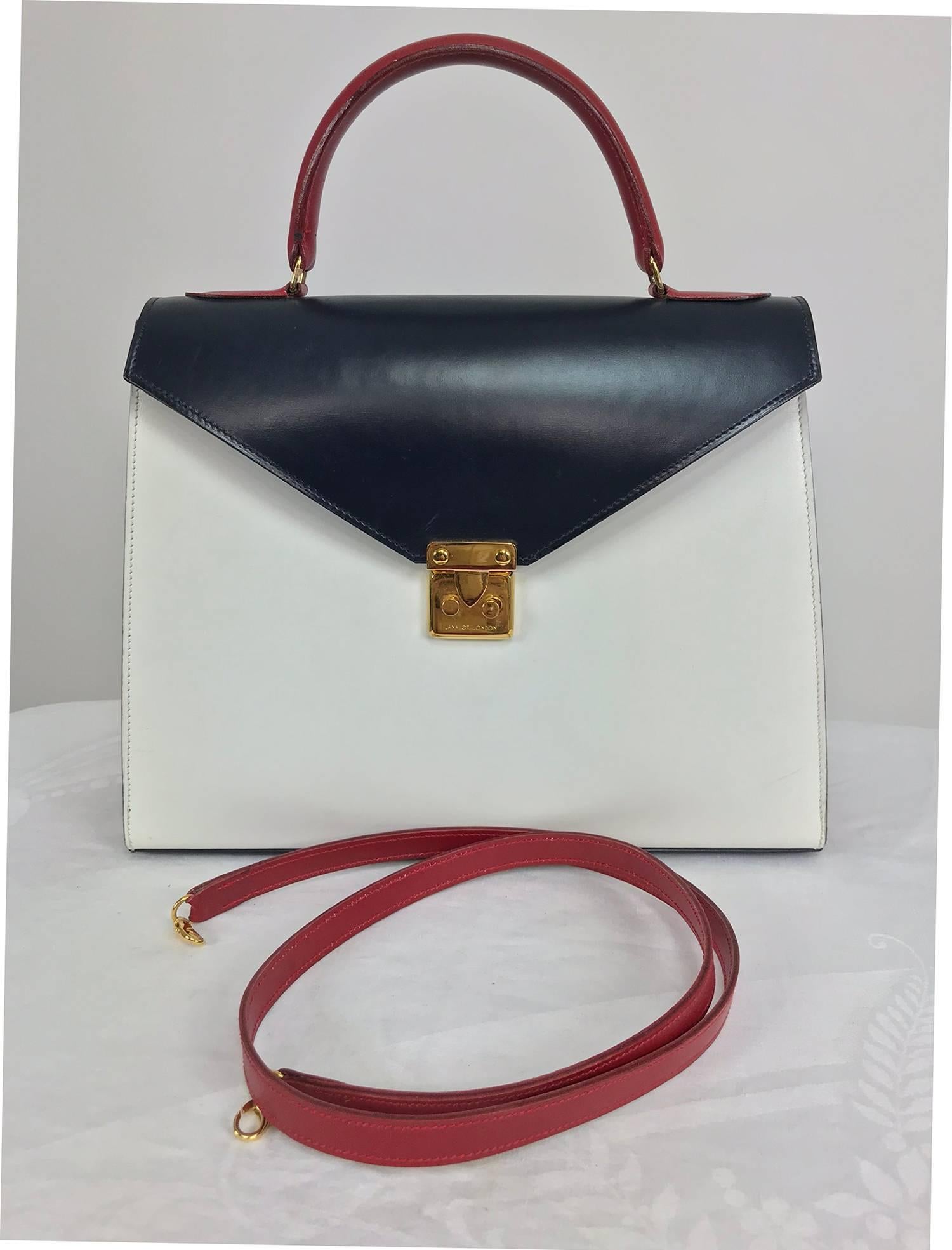 Lana of London red white and blue box calf handbag with gold hardware and shoulder strap. Beautifully crafted bag in colour blocked  red, white and blue. Top handle bag comes with removable shoulder strap. Fully lined in buttery soft red leather,
