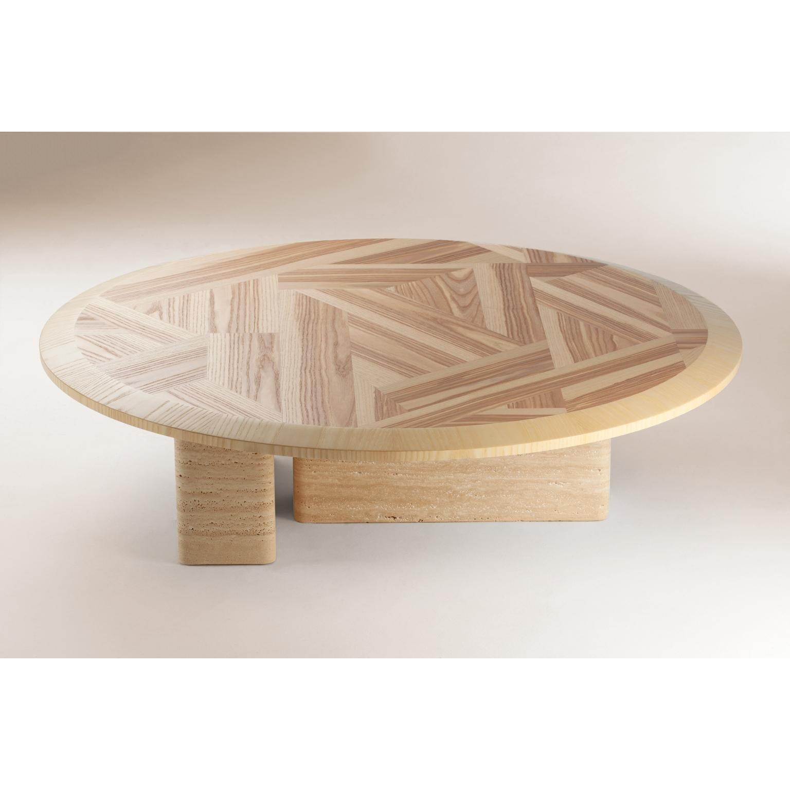 L’anamour center table by Dooq
Dimensions: D 110 x W 110 x H 30 cm
Materials: 
Top: Natural or nude olive ash
Base: Natural travertine or nude lacquered wood

Other options available.

L’anamour is a set of coffee and side tables, which