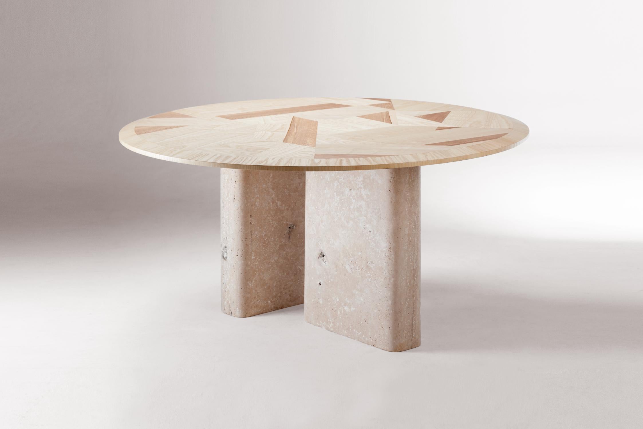 L’anamour dinner table by Dooq
Dimensions: ø 150 x H 78 cm
Materials: Ash wood, natural travertine.

L’anamour is a dining table where the connection between the base and the top is as perfect as a poet-muse relationship?, ?with emotions flying