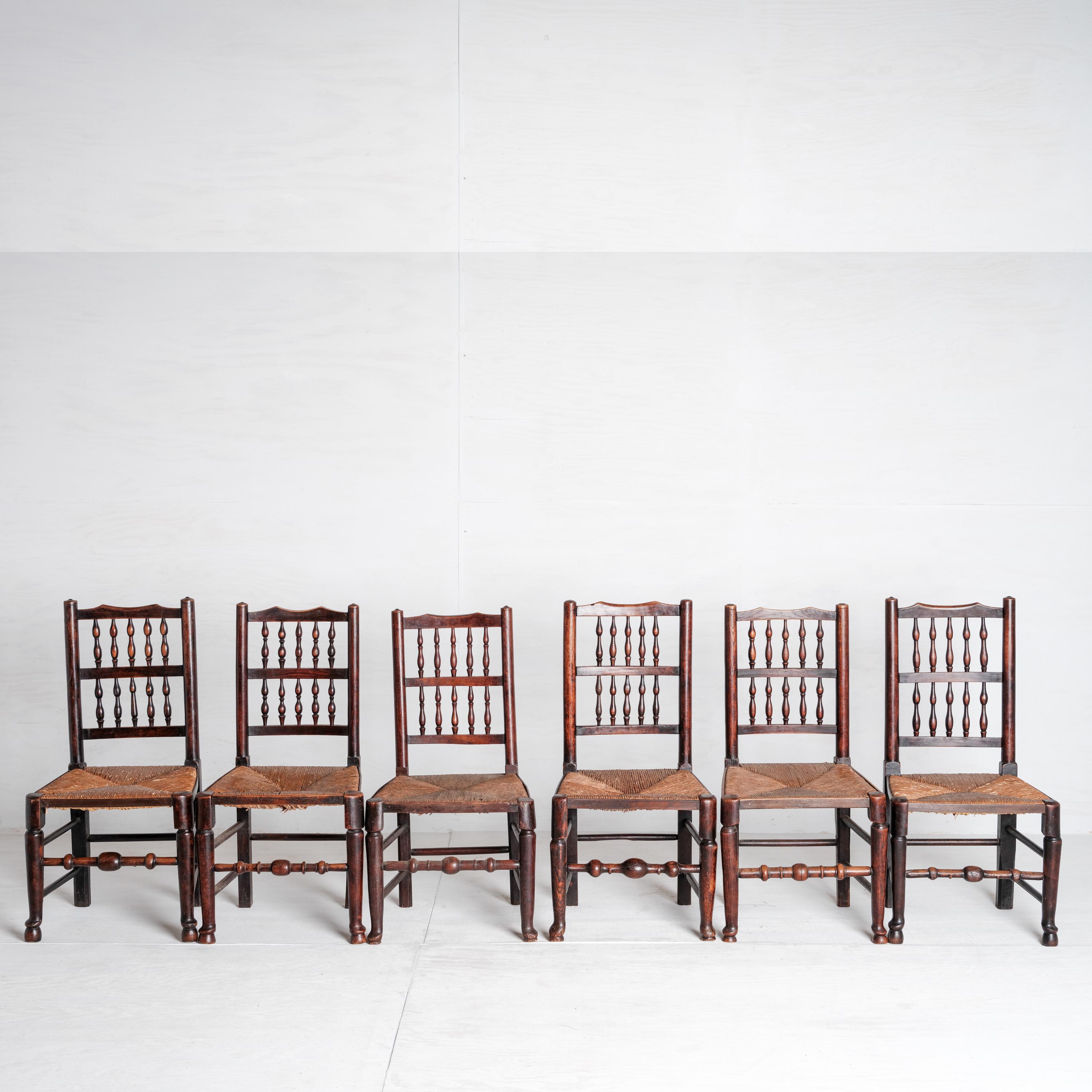 This set of six Lancashire Spindle Back Farmhouse Chairs were made between 1870-1880. Lancashire, a county in North West England, is known for witches, cheese, and chairs like these. 

The chairs measure 38