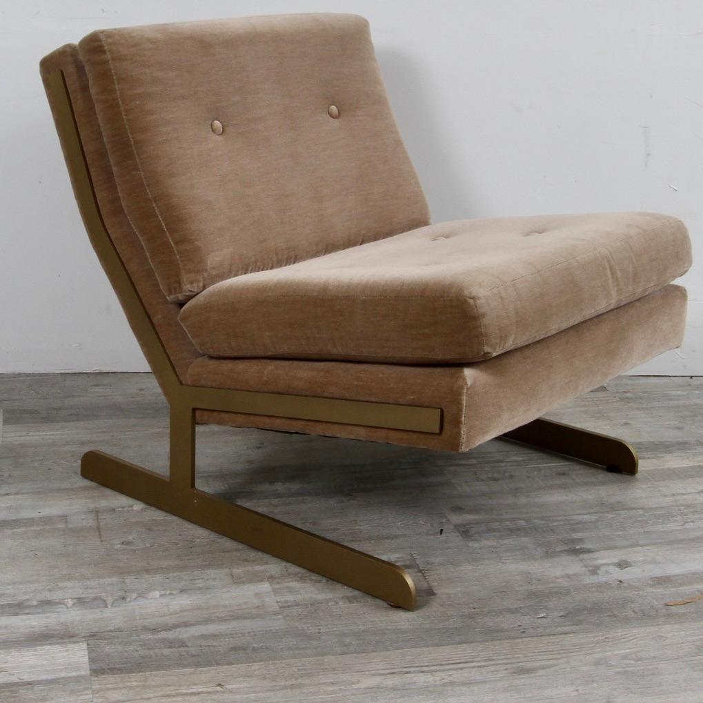 Mid-century inspired Lance chair upholstered in a brown mohair with 2 button tufting supported by a brass frame, making this a unique piece to dress up your living room with.