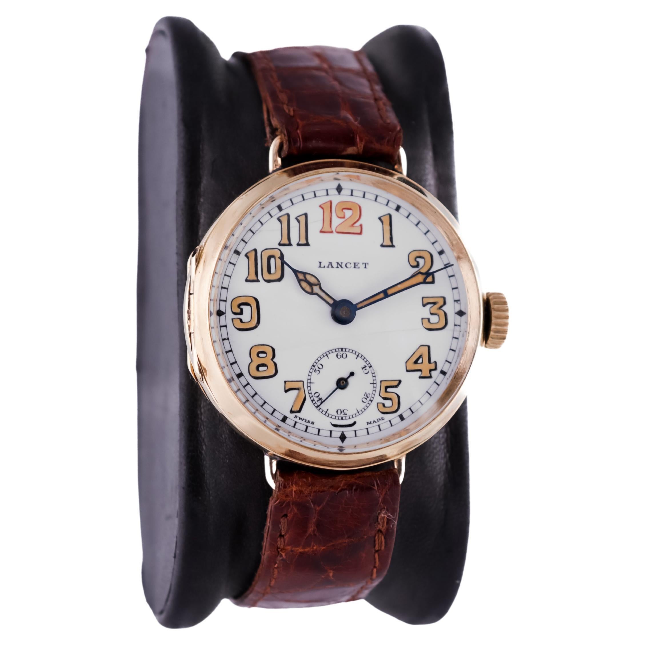 FACTORY / HOUSE: Lancet France 
STYLE / REFERENCE: Campaign Style / Trench Watch
METAL / MATERIAL: 18Kt. Yellow Gold 
CIRCA / YEAR: 1915
DIMENSIONS / SIZE: 37mm Length X 33mm Diameter
MOVEMENT / CALIBER:  Manual Winding /  15 Jewels
DIAL / HANDS: 
