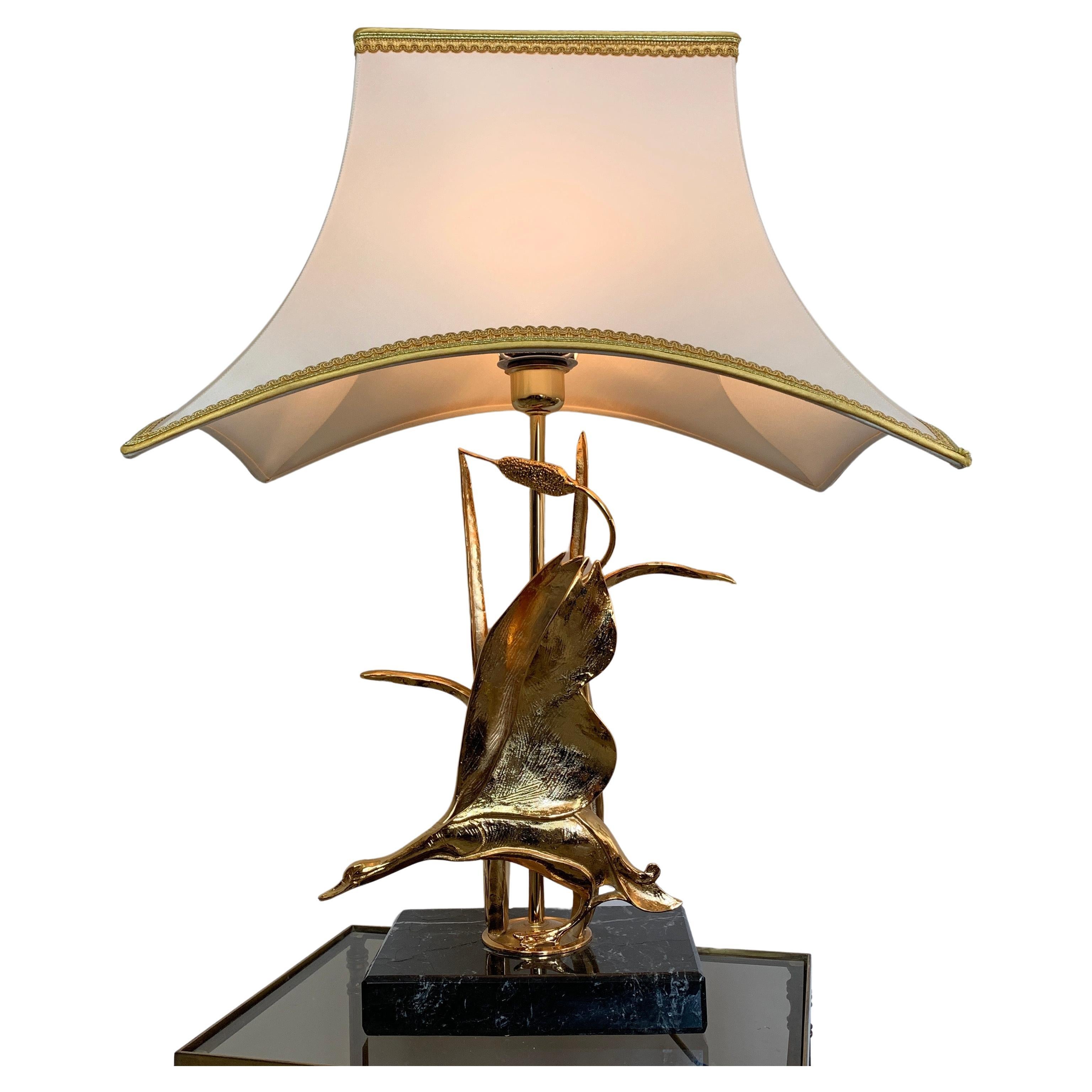 Lanciotto Galeotti Table Lamp, Italy 1970s For L'originale
Midcentury gold plated table lamp depicting a flying goose and bulrushes
The brass based bird sculpture is mounted on a marble/travertine stone base, typical of Italian lamps of this era.