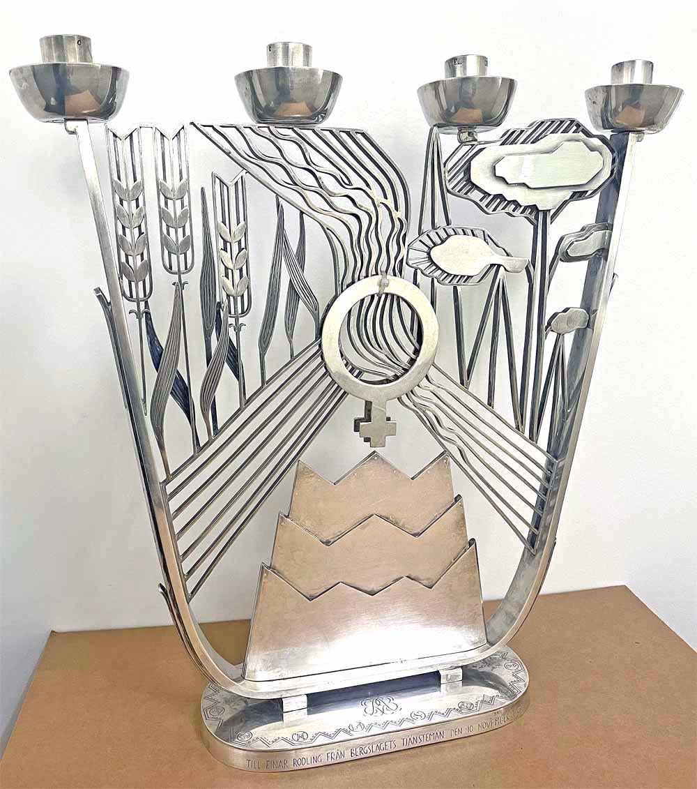 Truly astonishing in concept and execution, this large, museum-quality silver candelabra is both a functional piece and a masterwork of Art Deco sculpture.  Designed by Swedish artist Per Sköld and commissioned by the Stora Kopparbergs Bergslags AB