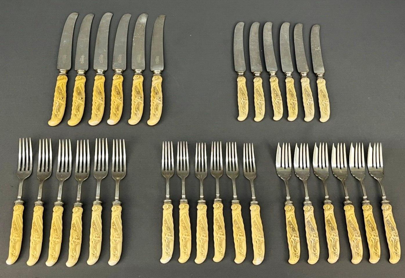 From the makers, Landers, Frary & Clark, a set of 30 table knives and forks with carved, ivory colored Celluloid handles, circa 1900-1920.

Landers, Frary & Clark was a housewares company established in 1862 and based in New Britain, Connecticut.