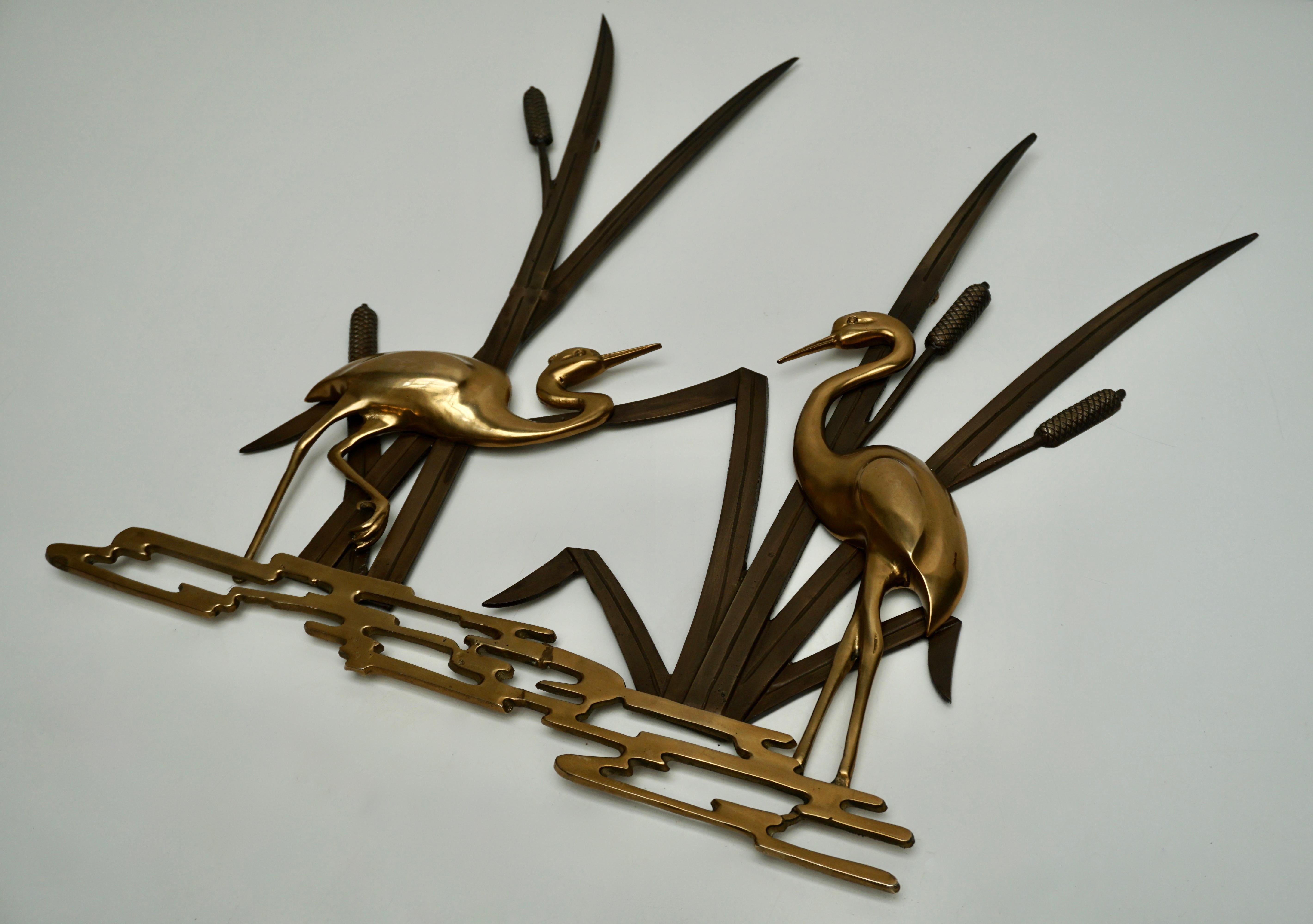 A beautiful vintage brass and bronze crane themed wall decoration. This decorative item would make a beautiful ornament on each wall.
Made in the 1960s it displays the joy of that great era with a bold, yet classy statement.