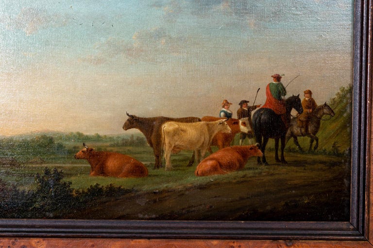 Pastoral landscape painting with cows in the medium oil on board with period frame, circa 1800s. The piece is signed 