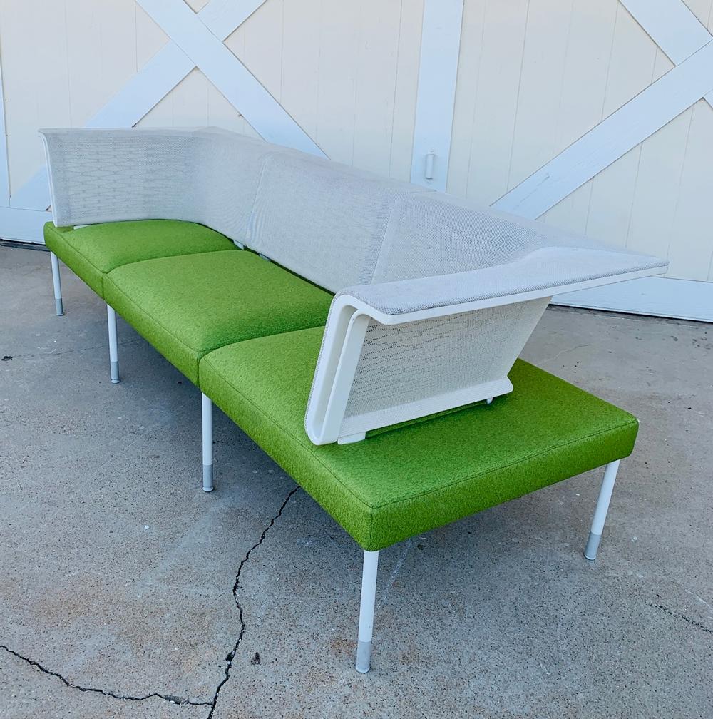 Designed by Yves Behar and manufactured by Herman Miller.

The landscape sofa is beautiful, great architectural lines, upholstered in a green fabric with a white mesh fabric on the back.
Perfect for Indoors or outdoors.
Manufactured in