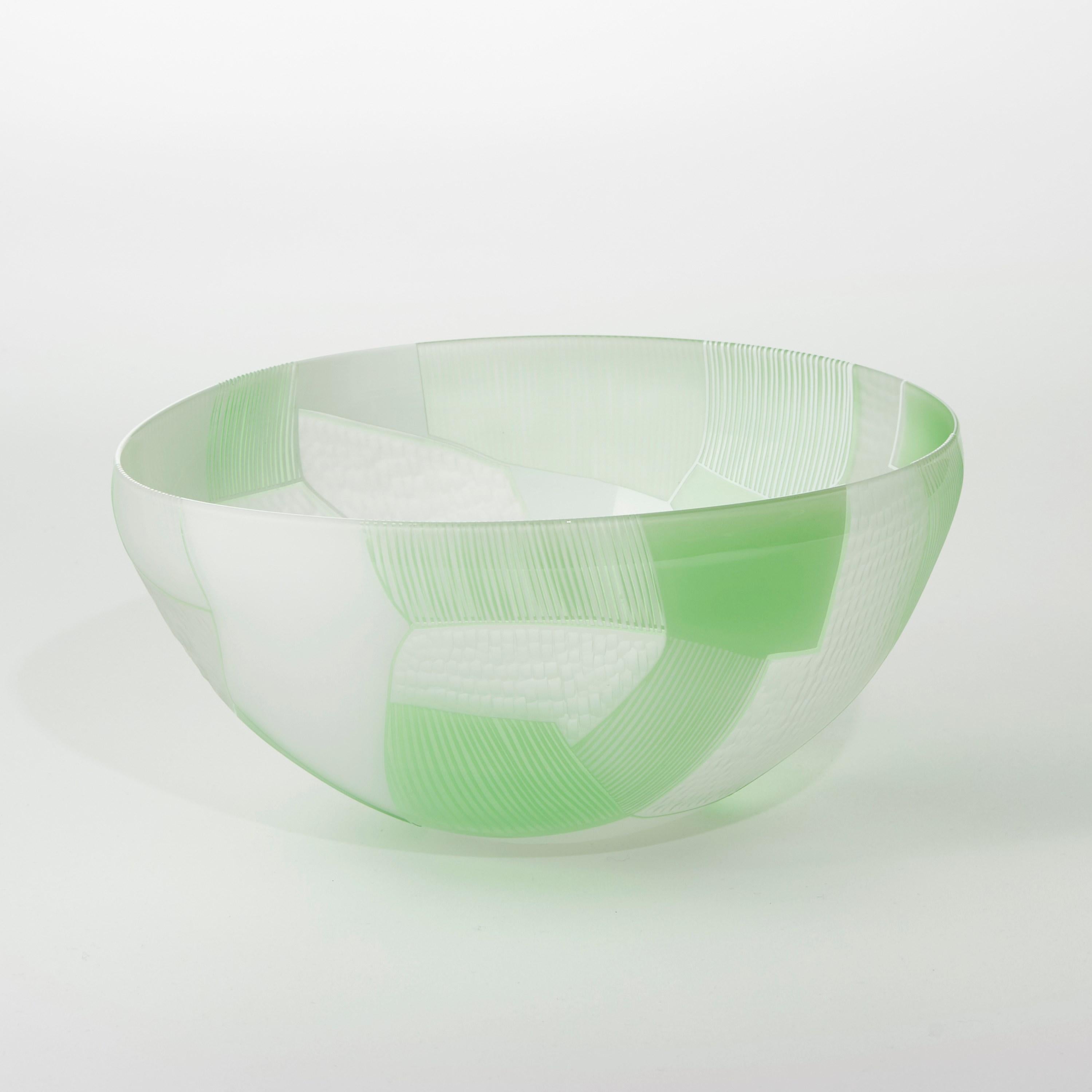 'Landscape Study Green over White' is a unique handblown and cut glass sculptural bowl by the British artist, Kate Jones of Gillies Jones.

Gillies Jones established their partnership in 1995 with a shared passion to explore blown art glass. Works