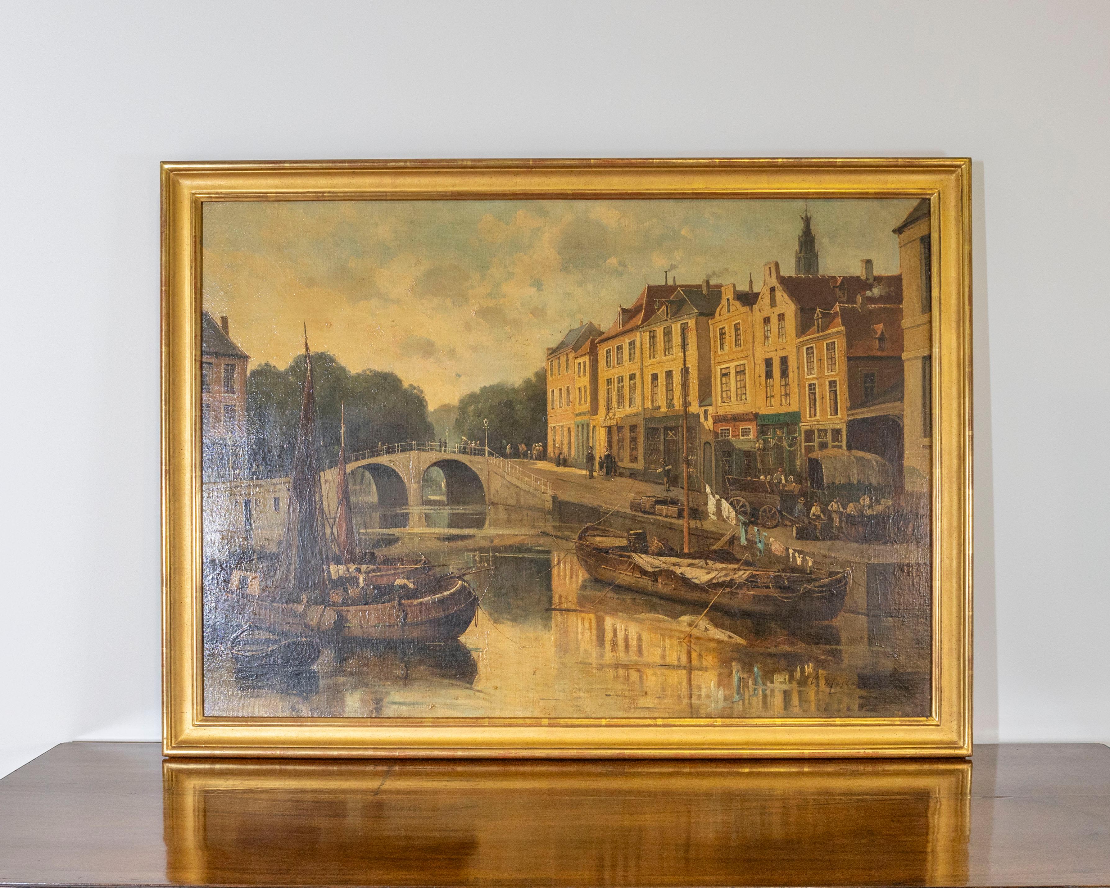 Une captivante peinture à l'huile du XIXe siècle représentant un port fluvial animé, probablement situé dans le nord de la France ou aux Pays-Bas, signée par l'artiste dans le coin inférieur gauche. Exécutée dans un style réaliste avec de subtiles