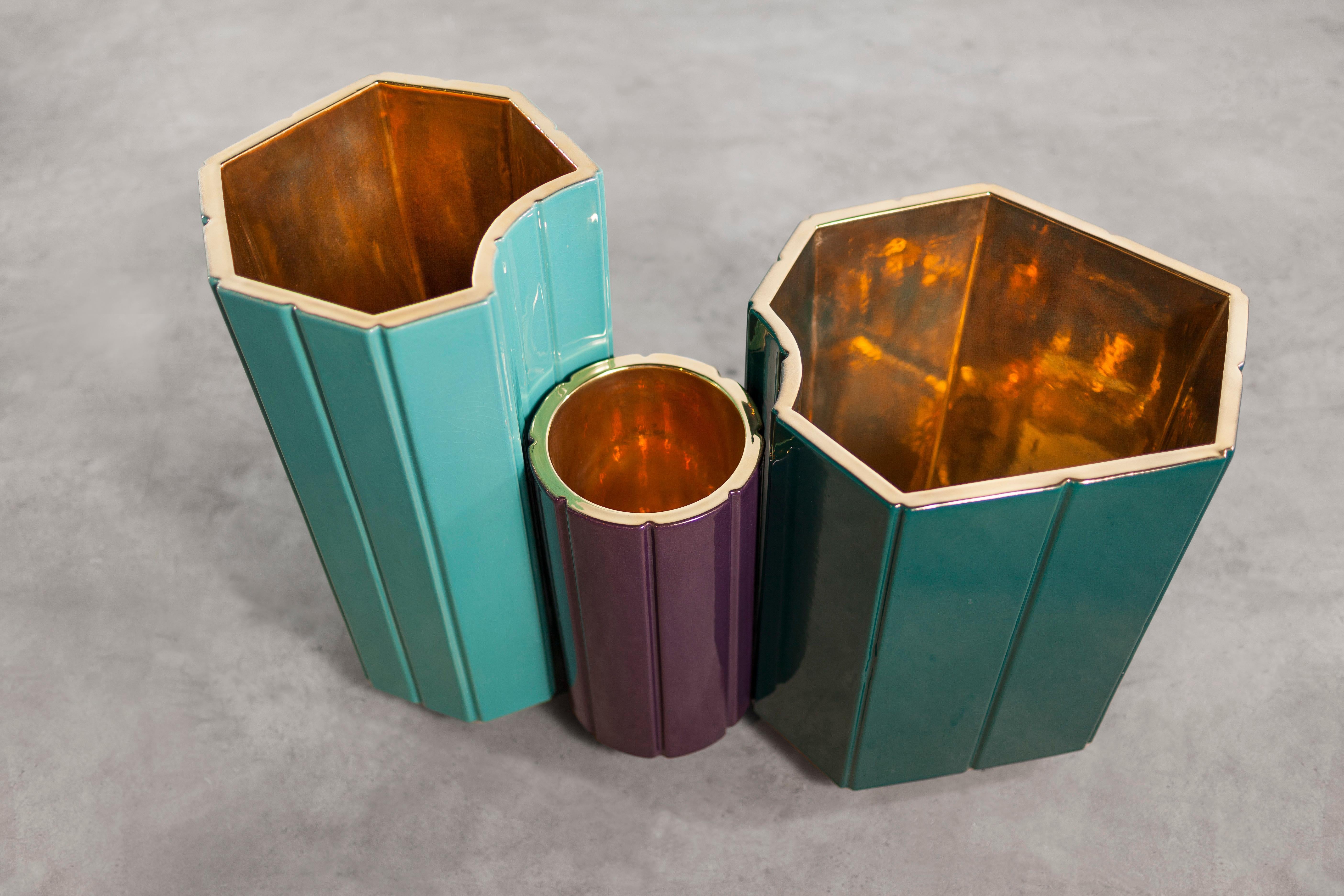 The landscapes vases are conceived in glazed ceramic with dense and vivid colours. Every element, every cell put on the ground composes the detail of an urban and graphic landscape. The scenery envisions the idea of the garden: a composition that