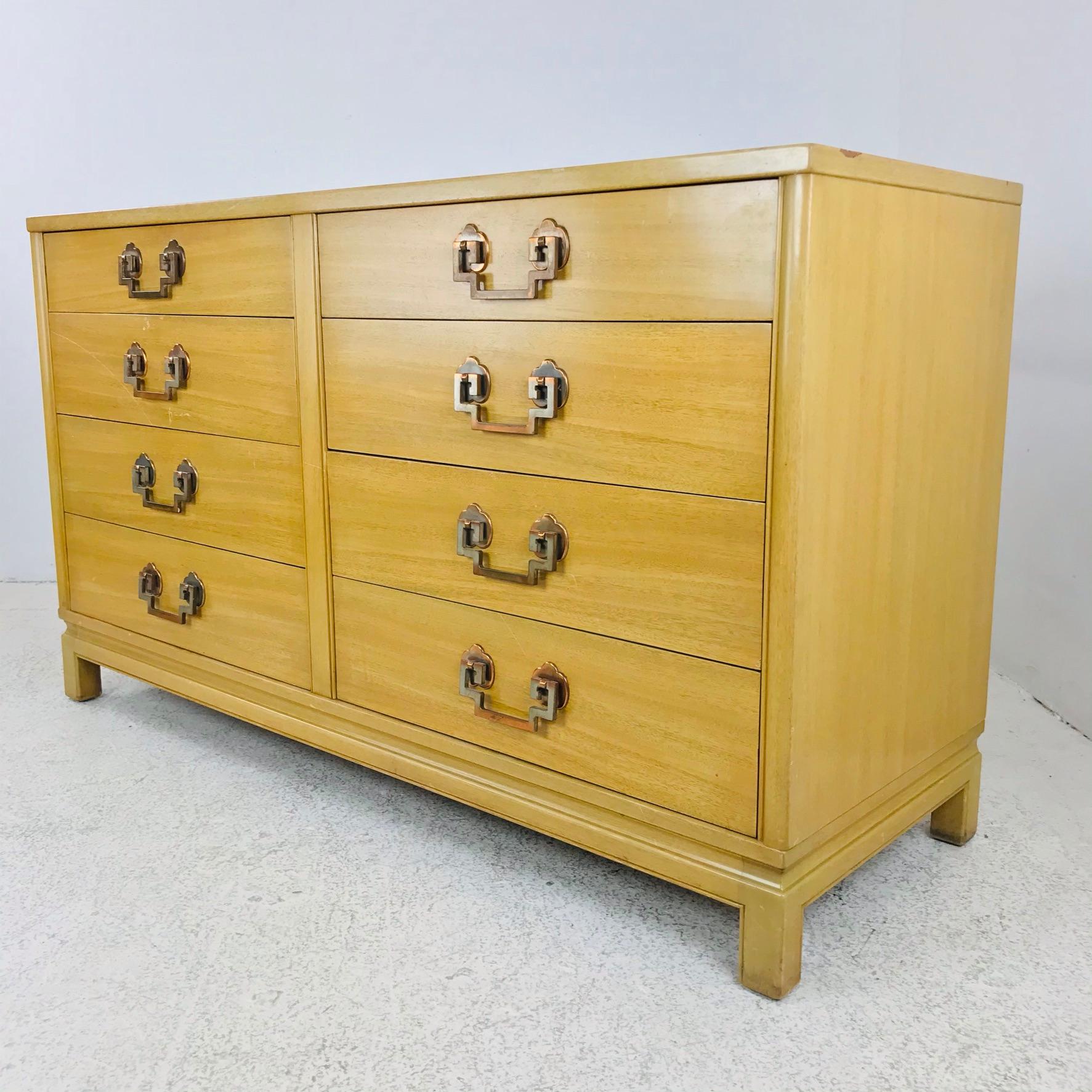 A handsome eight-drawer bleached mahogany dresser made by Landstrom. Features beautiful hardware made of Greek key motif over quatrefoil design.