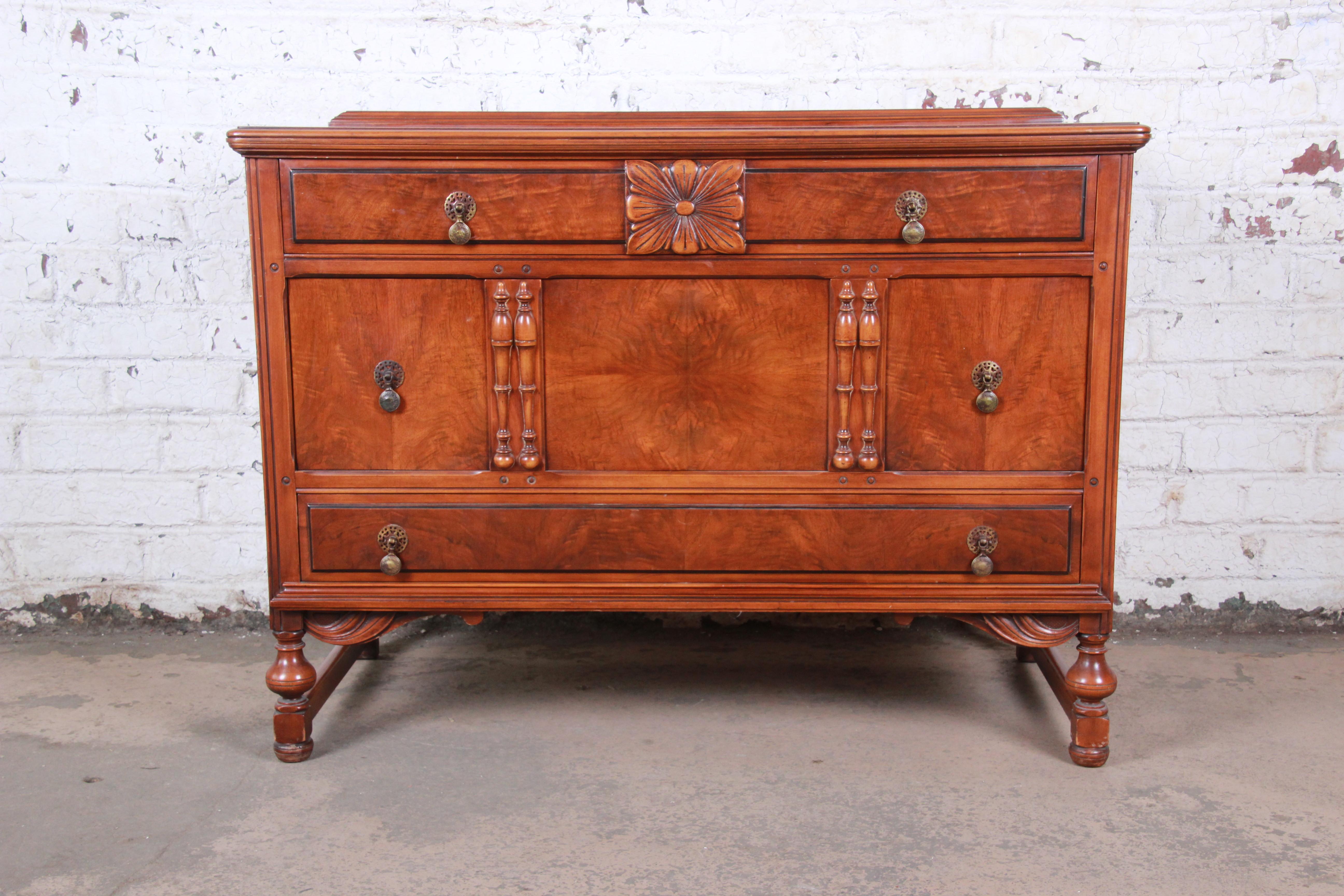 A gorgeous French carved burled walnut dresser

By Landstrom Furniture

USA, circa 1940s

Burled walnut and brass hardware

Measures: 48.13