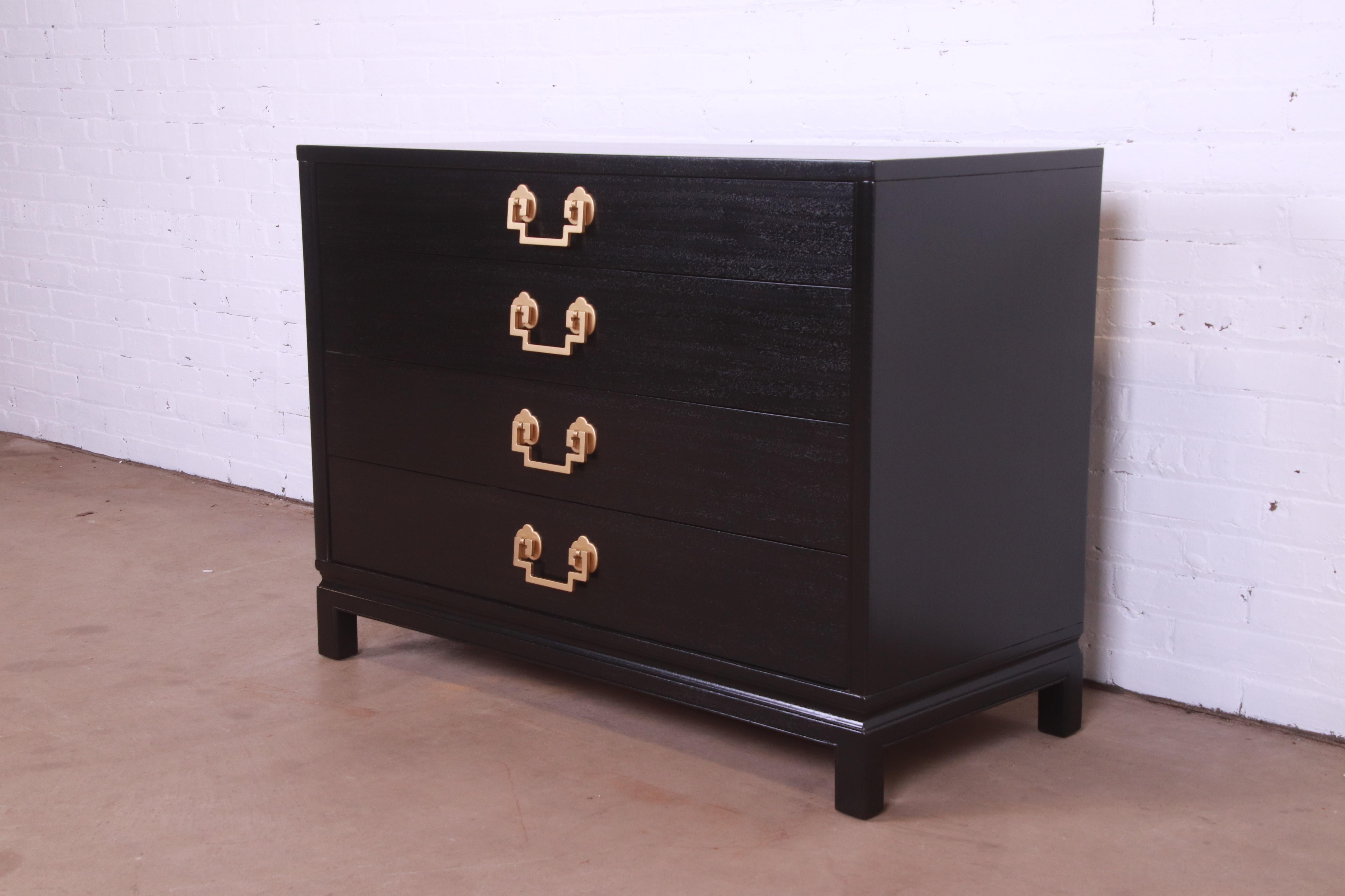 An exceptional mid-century modern Hollywood Regency Chinoiserie four-drawer dresser chest or commode

By Landstrom Furniture

USA, 1952

Black lacquered mahogany, with Asian-inspired brass hardware.

Measures: 44