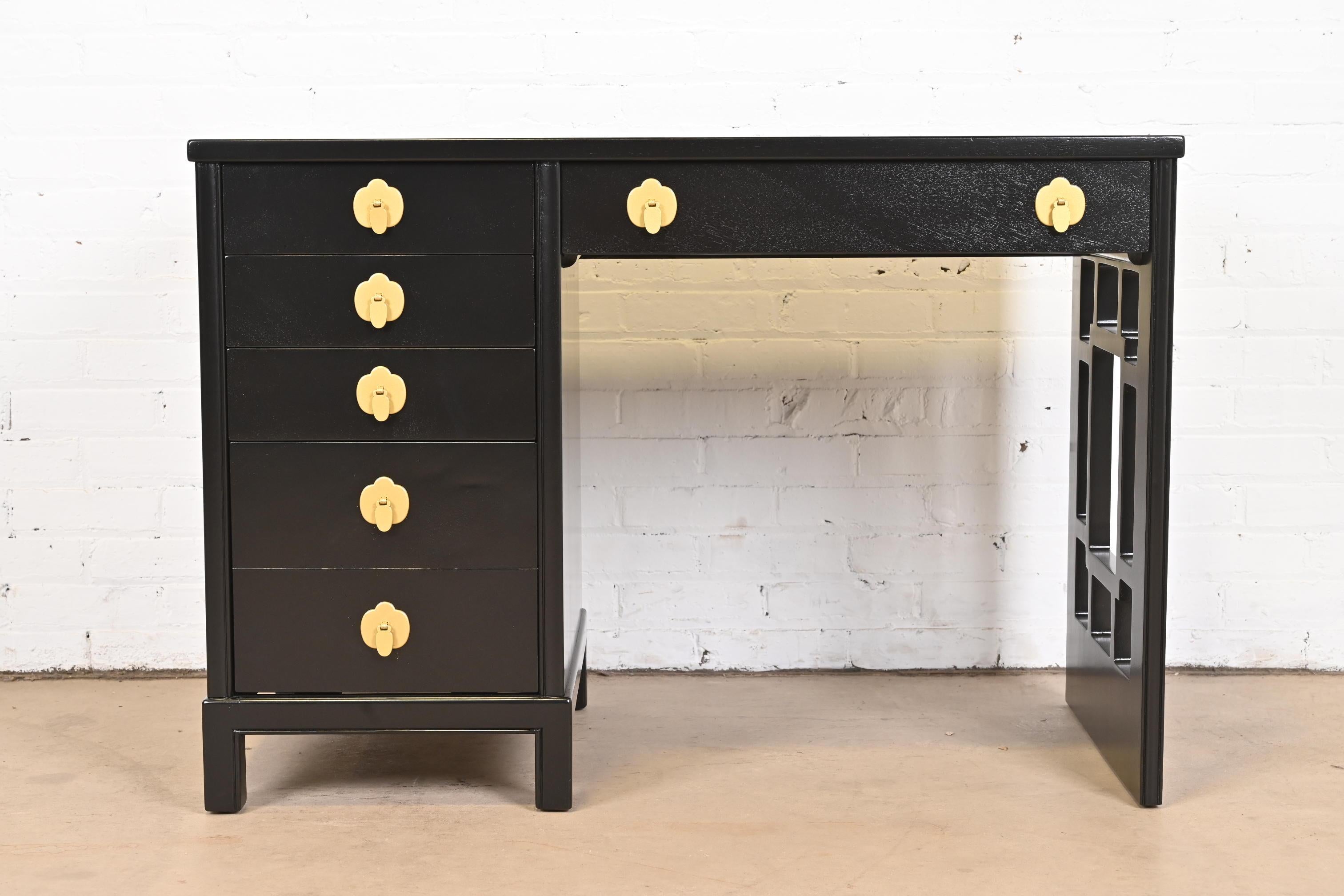 An exceptional Mid-Century Modern Hollywood Regency Chinoiserie writing desk

By Landstrom Furniture.

USA, 1950s

Black lacquered mahogany, with Asian-inspired brass hardware.

Measures: 42