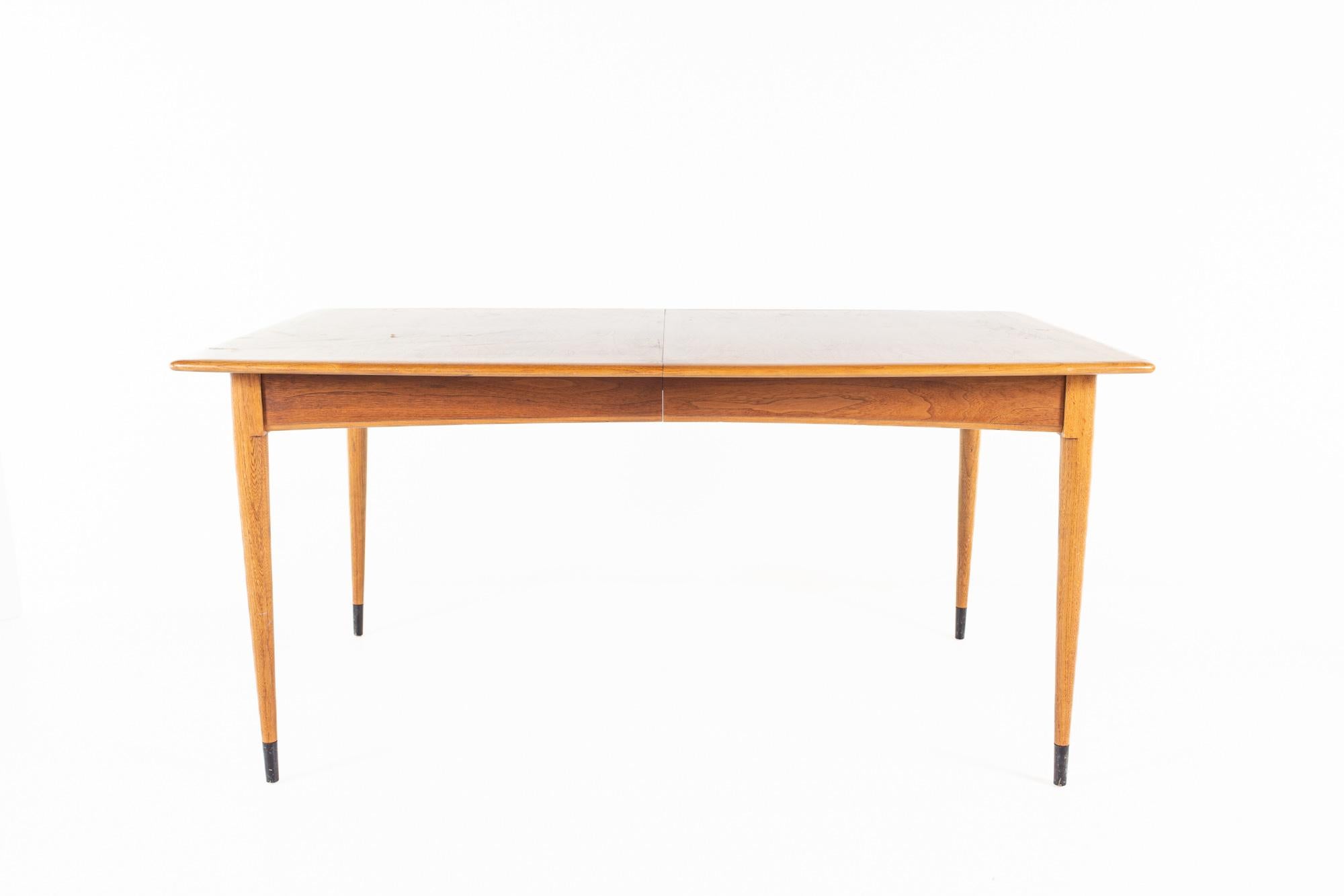 Lane Acclaim Mid Century Dovetail dining table

The table measures: 61.5 wide x 38 deep x 29 high, with a chair clearance of 25 inches 

All pieces of furniture can be had in what we call restored vintage condition. That means the piece is